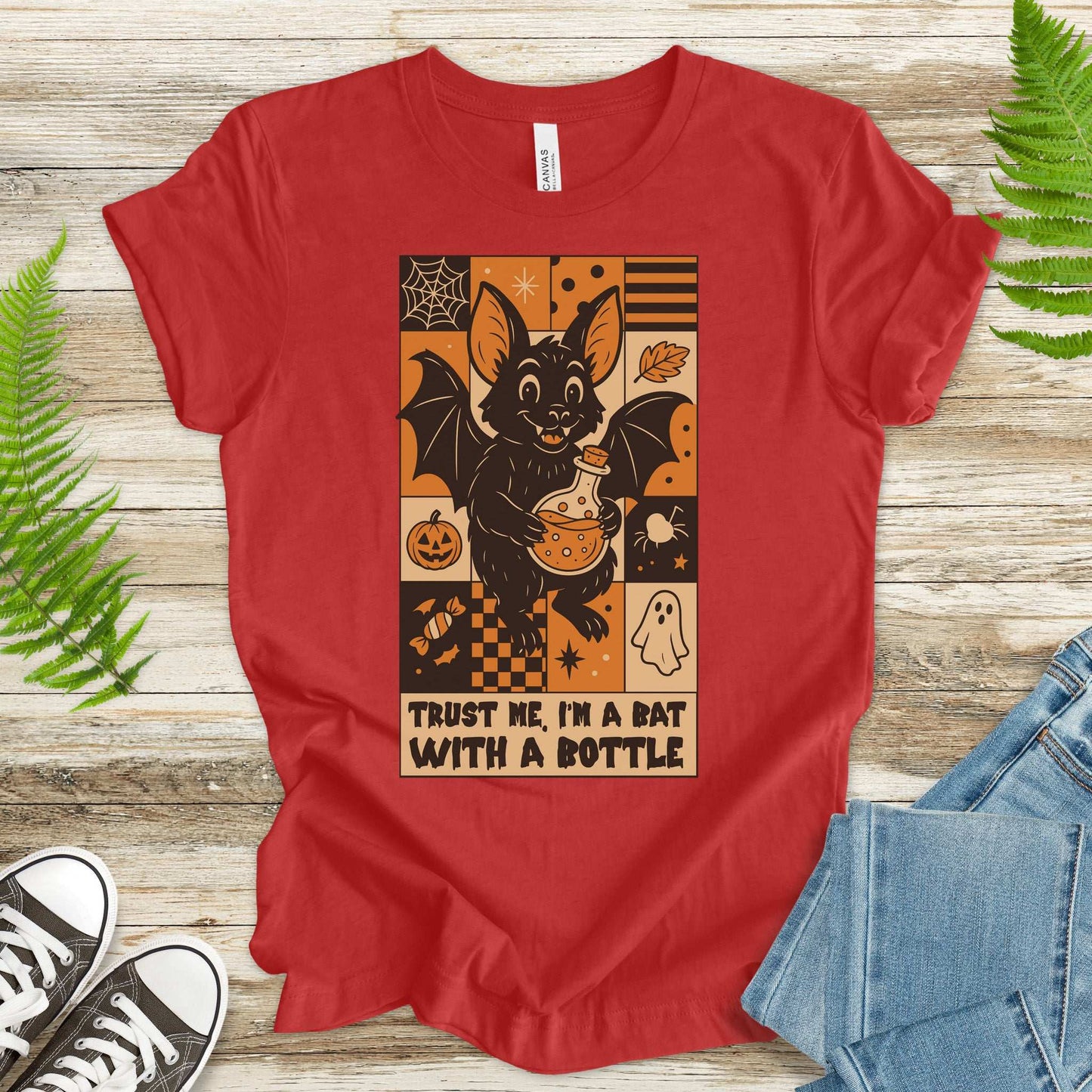 Potion Bat Halloween T-shirt featuring a cute bat with a bottle, perfect for spooky season and retro Halloween fans.