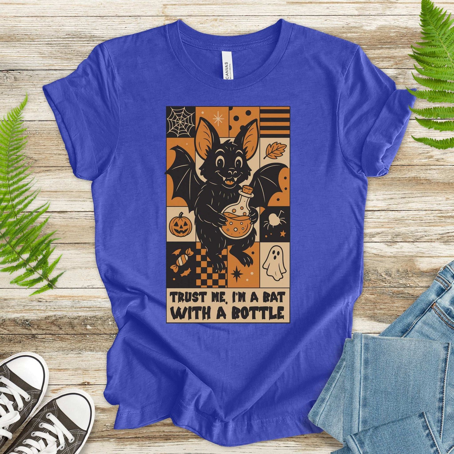 Potion Bat Halloween T-shirt featuring a bat with a potion, perfect for spooky vibes and retro charm.