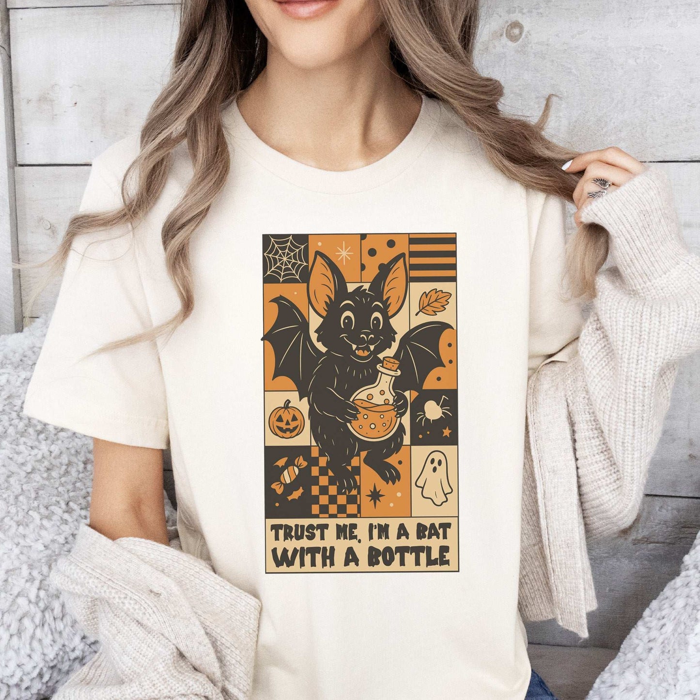 Potion Bat Halloween T-shirt design featuring a retro bat holding a potion, perfect for spooky enthusiasts.