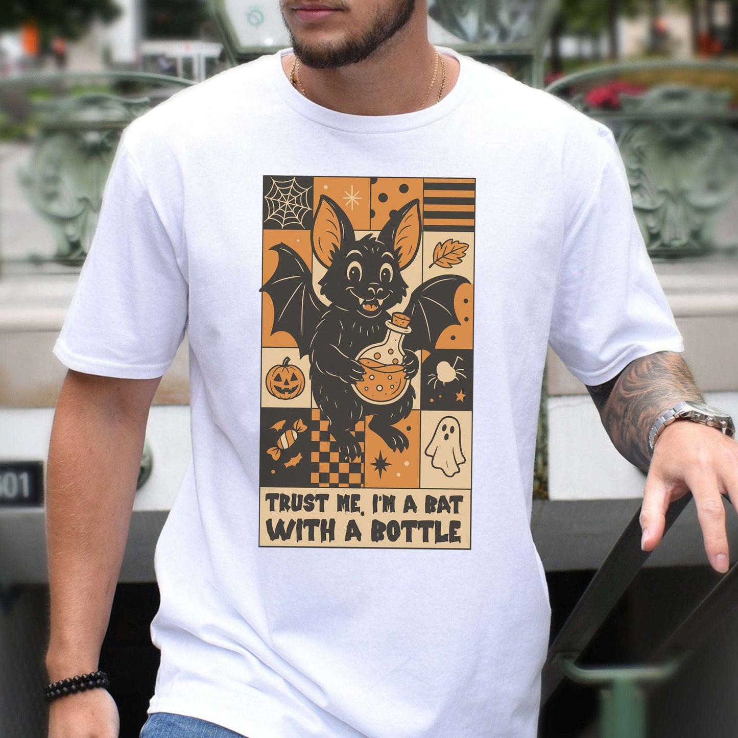 Potion Bat Halloween T-shirt featuring a whimsical retro bat design with a potion bottle.