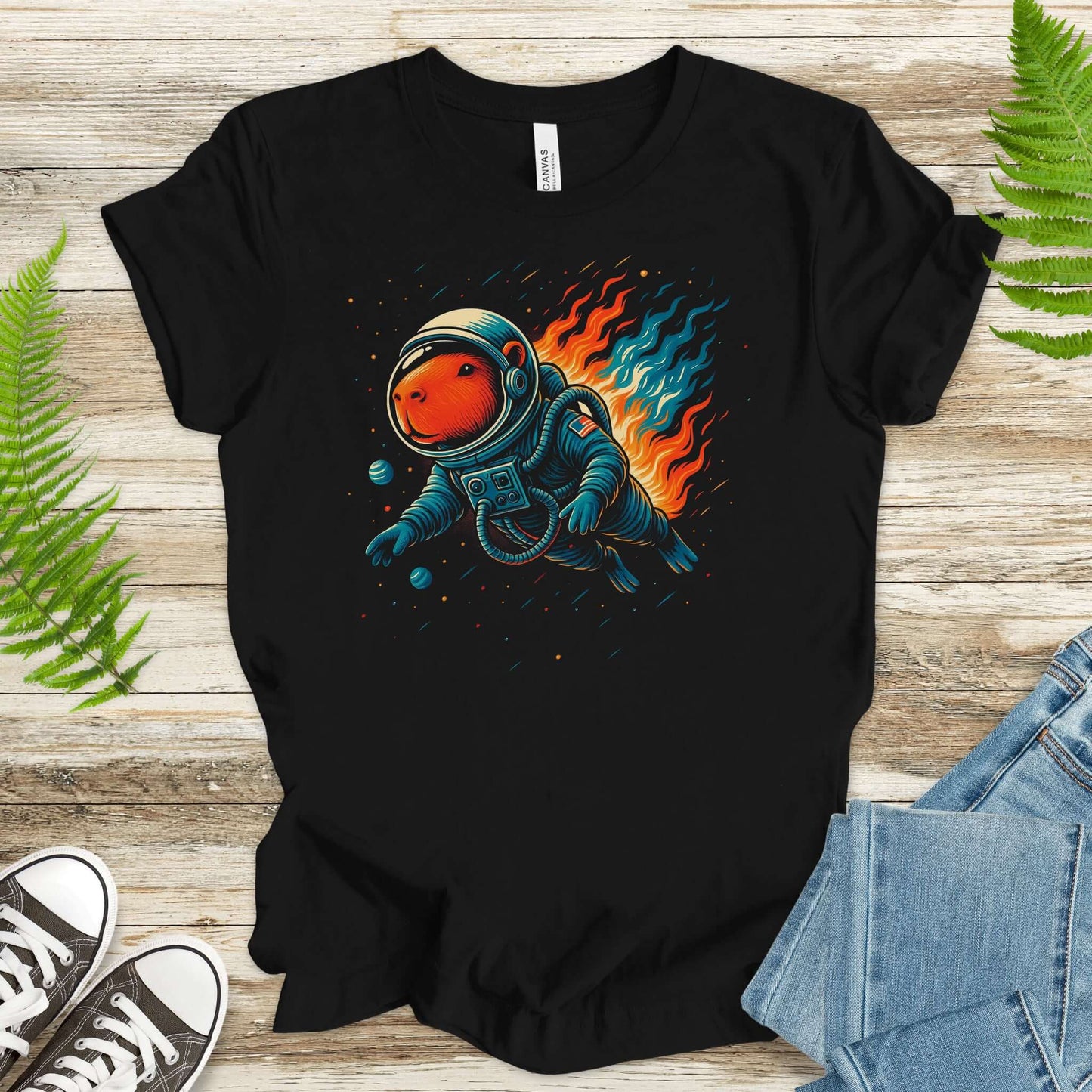 Capybara astronaut t-shirt for fantasy lovers, featuring an adorable capybara in space with colorful flames.