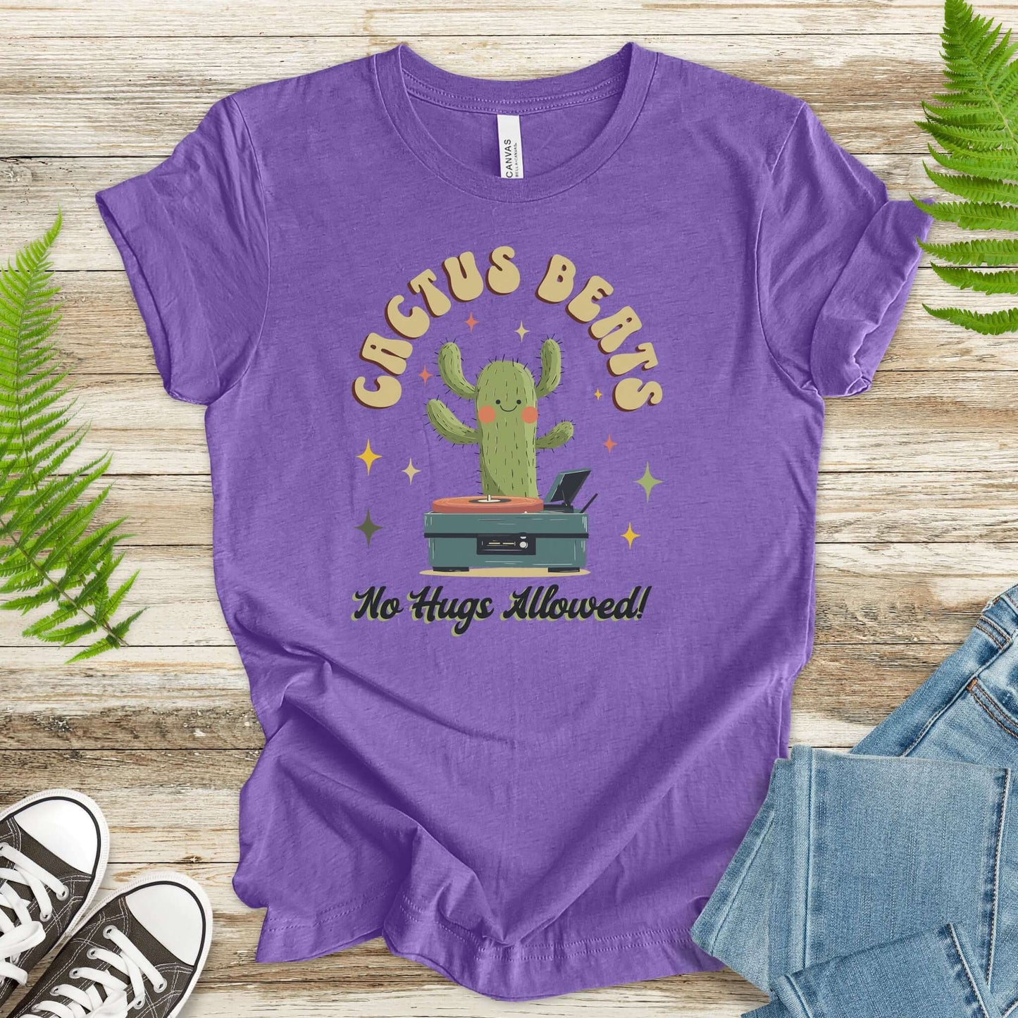 Funny retro style graphic tee featuring a cactus DJ with the text 'Cactus Beats No Hugs Allowed!'. Soft cotton fabric.