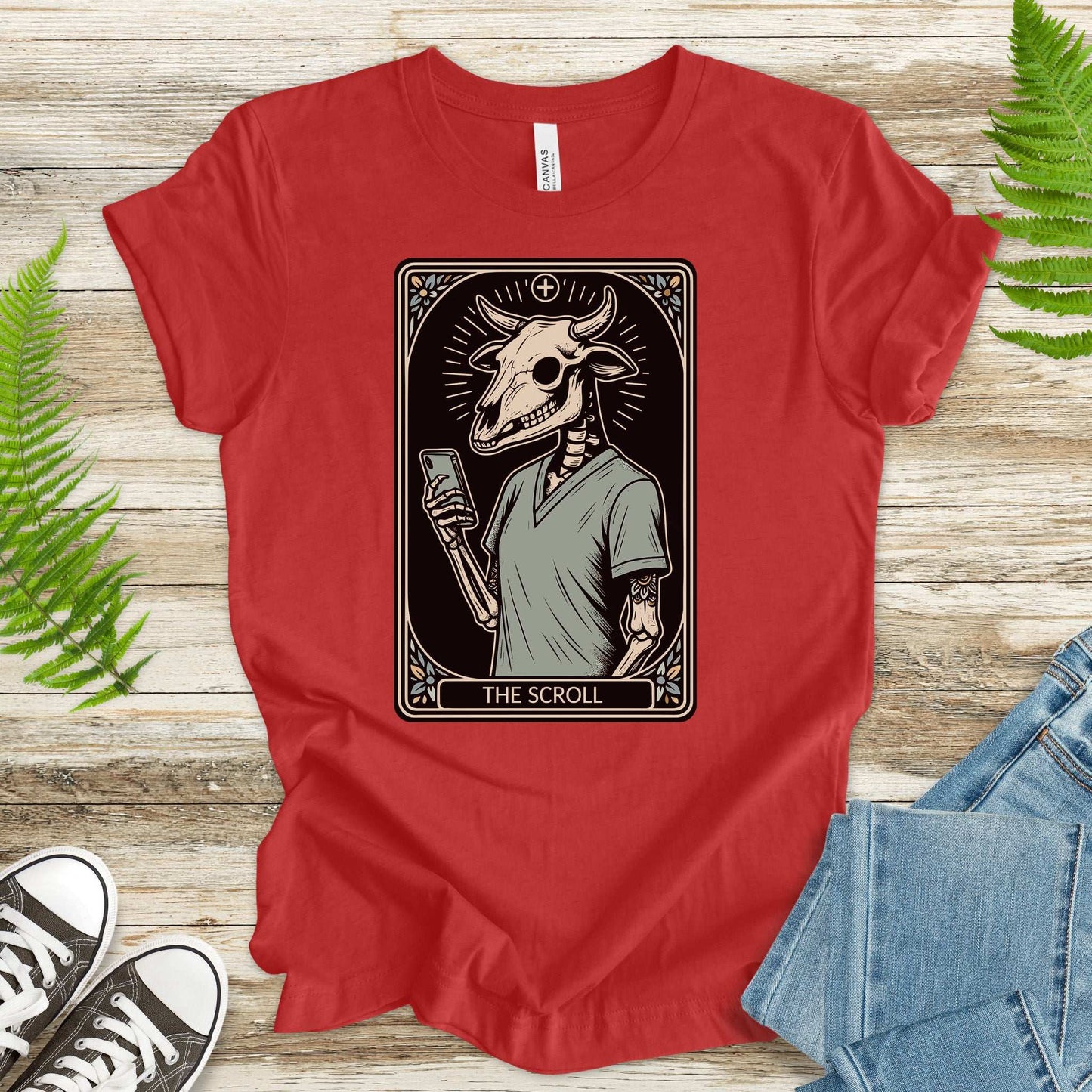 The Scroll Skeleton T-Shirt features a bull skull design perfect for tarot and tech lovers.