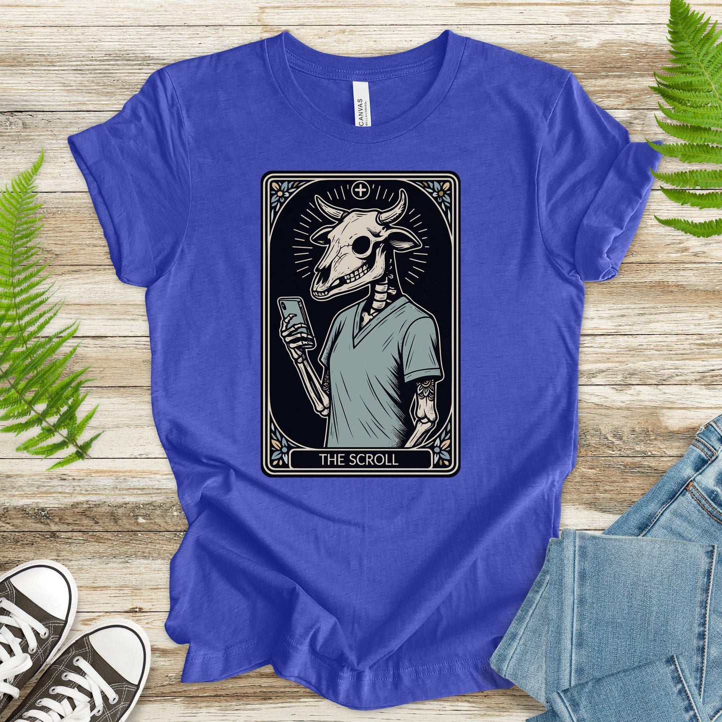 The Scroll Skeleton T-Shirt featuring a bull skull in a tarot card design, perfect for tech and tarot enthusiasts.