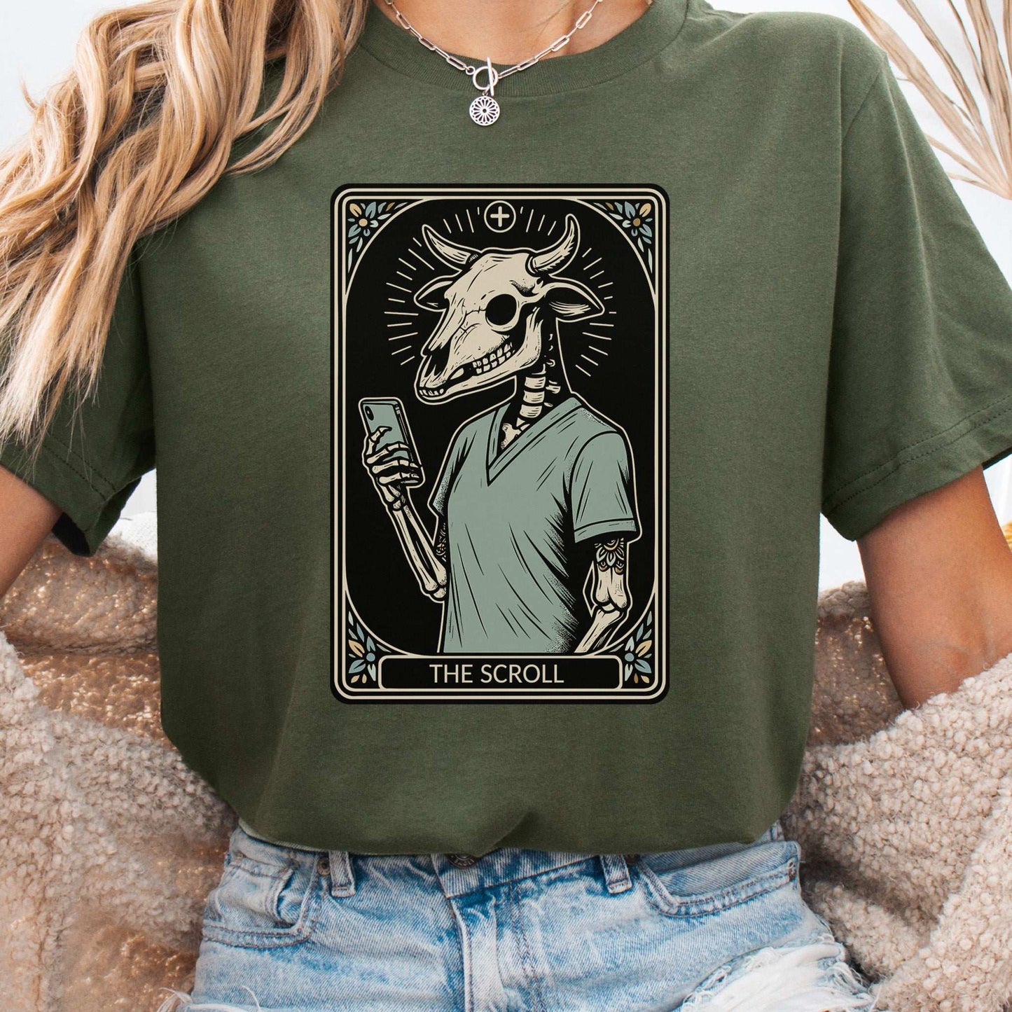 Bull Skull Tarot Card T-shirt featuring a skeleton using a phone, blending modern doom and mysticism.