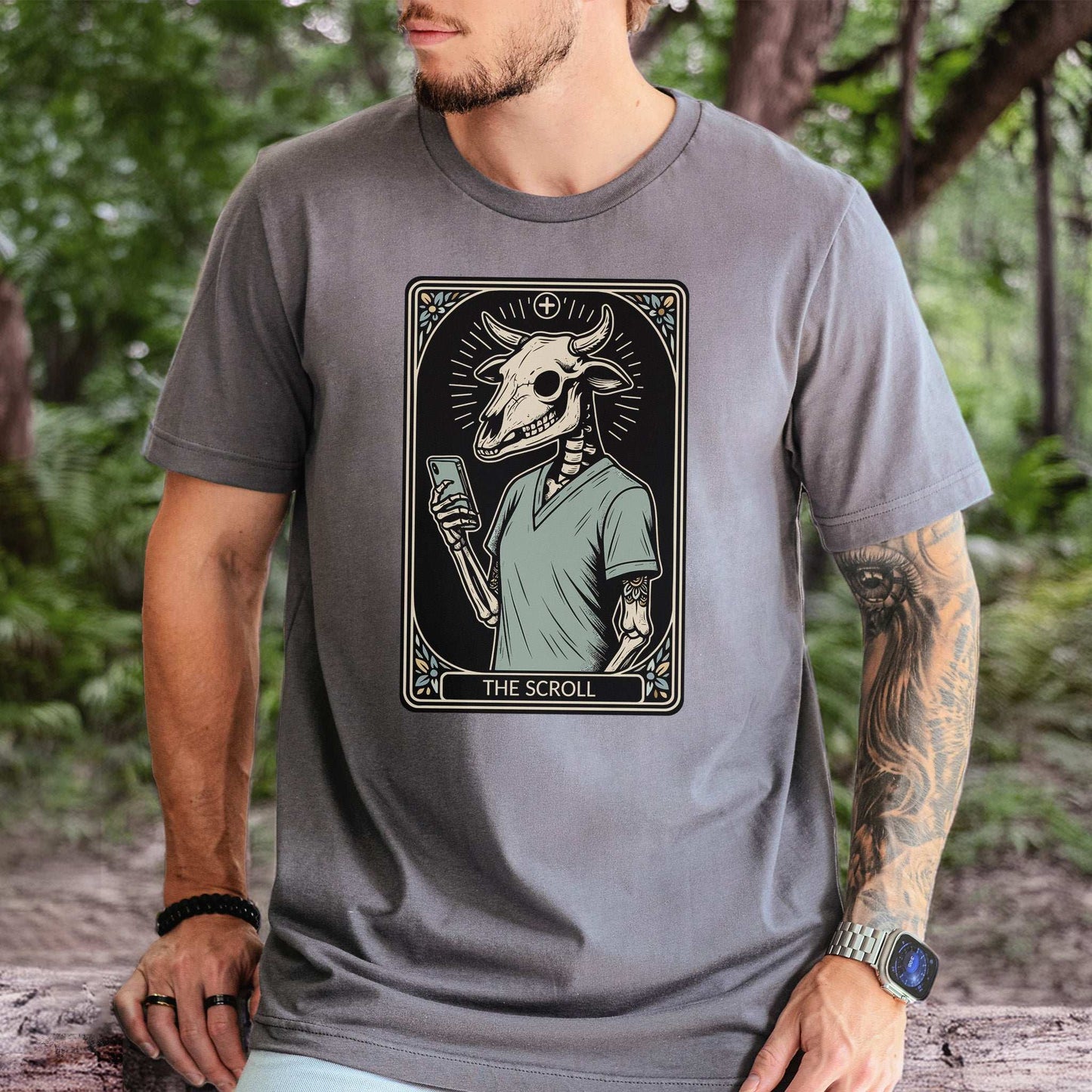 The Scroll Skeleton T-shirt featuring a bull skull design, merging tarot card and tech themes for modern fashion.