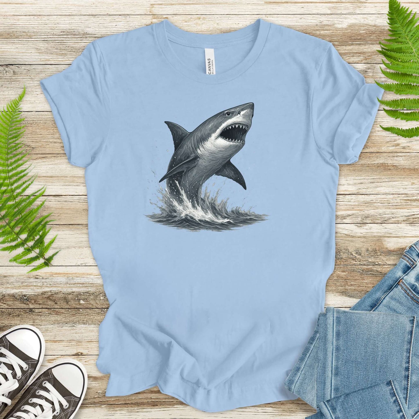 Great White Shark T-Shirt in light blue, featuring a shark breaching the ocean surface, ideal for shark lovers.