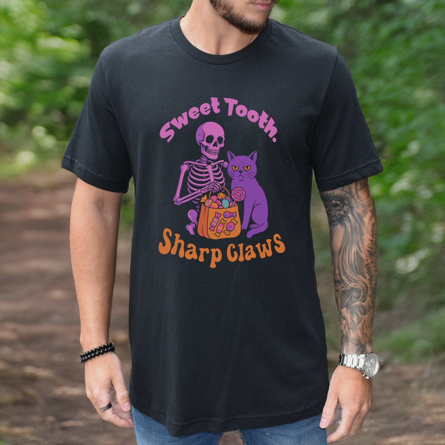 Skeleton and Grumpy Cat Halloween T-shirt featuring 'Sweet Tooth, Sharp Claws' design, perfect for spooky season.