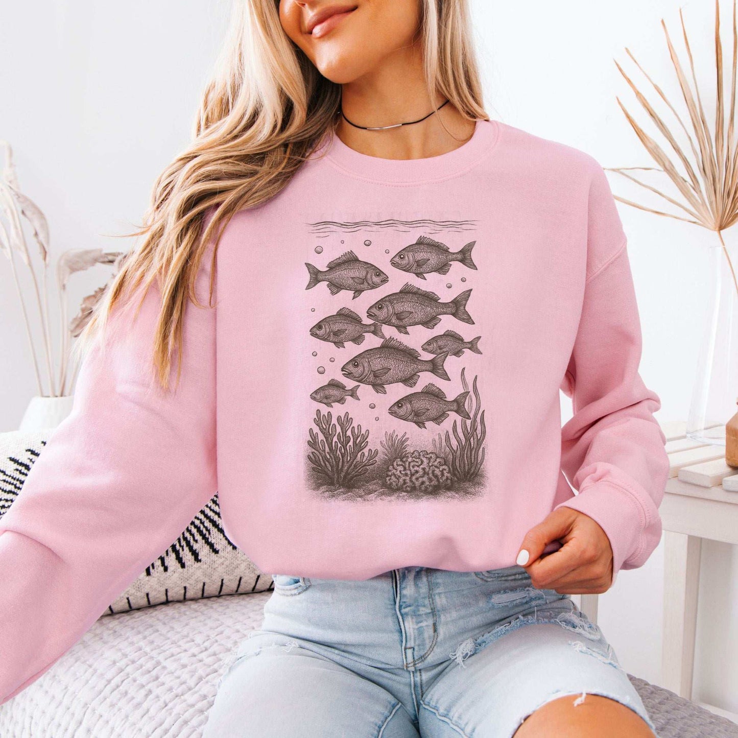 Fish sweatshirt featuring hand-drawn school of fish and coral, perfect ocean life gift for locals and underwater lovers.
