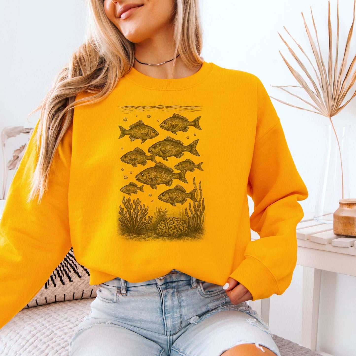 Fish sweatshirt featuring a retro school of fish, reminding to respect the locals of ocean life.