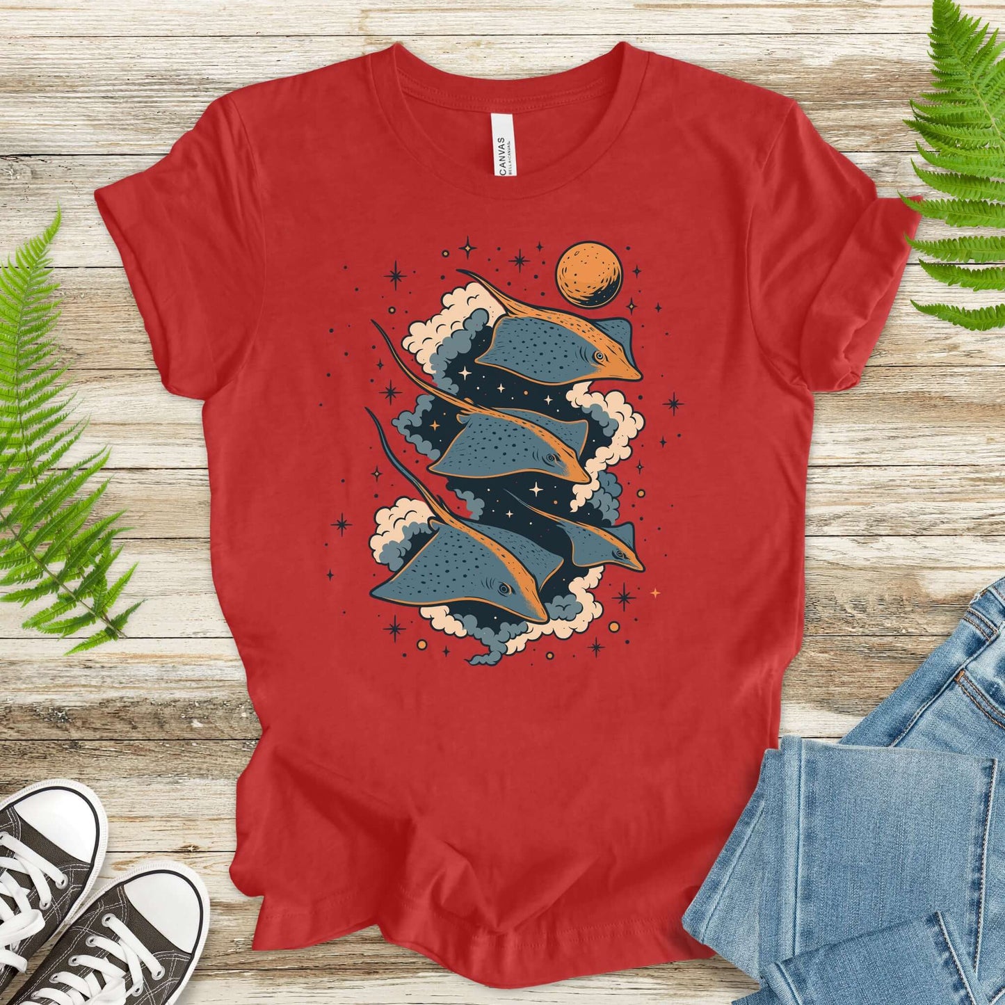 Red fantasy t-shirt featuring flying trigons gliding through a cosmic background with planets and clouds.