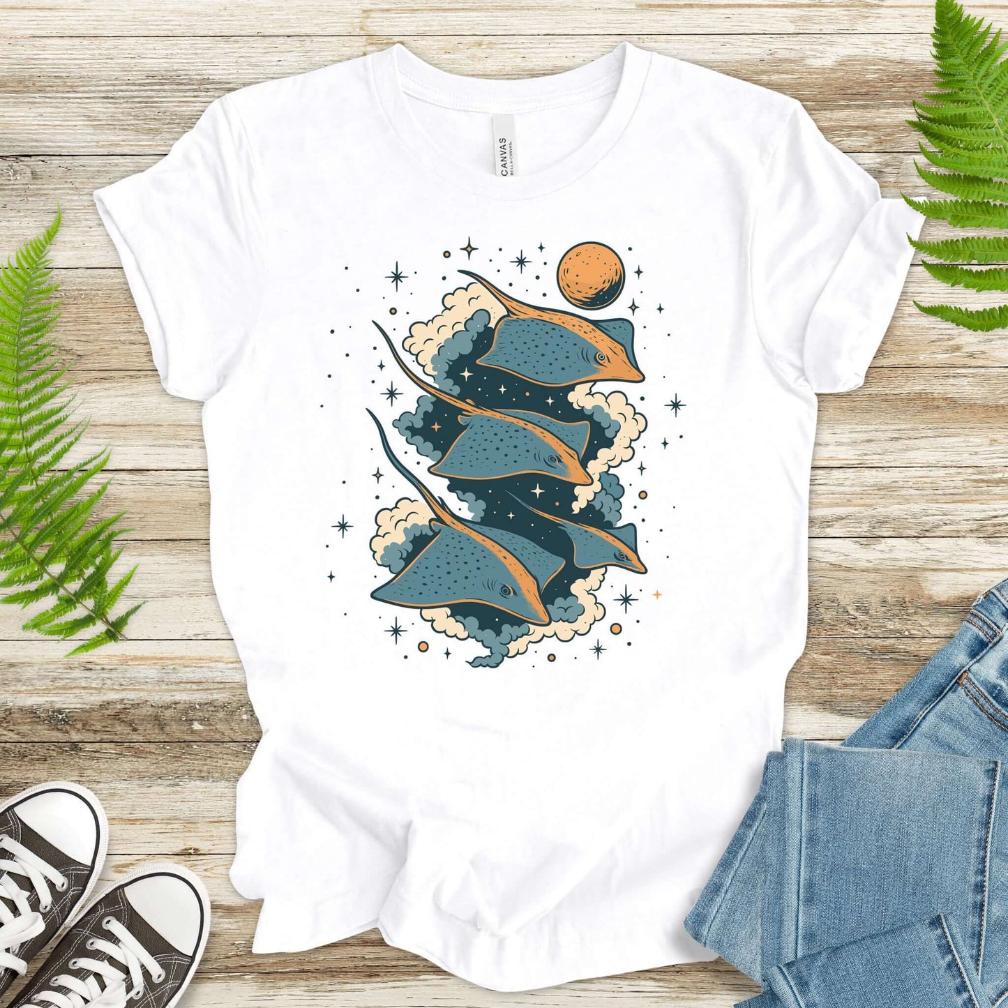 Fantasy trigon t-shirt featuring majestic stingrays gliding through a cosmic scene with stars and planets.