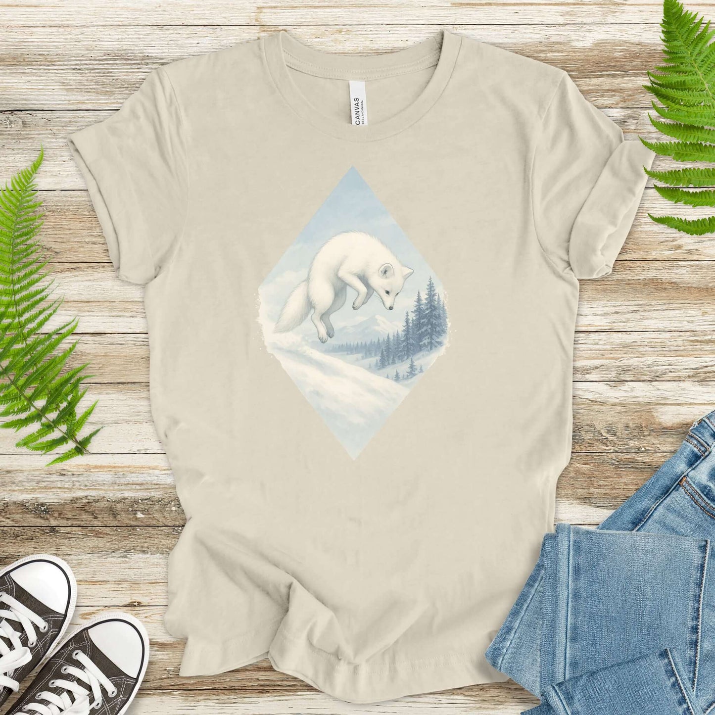 Jumping white fox in snow design on a light shirt, perfect for fantasy lovers and animal enthusiasts.