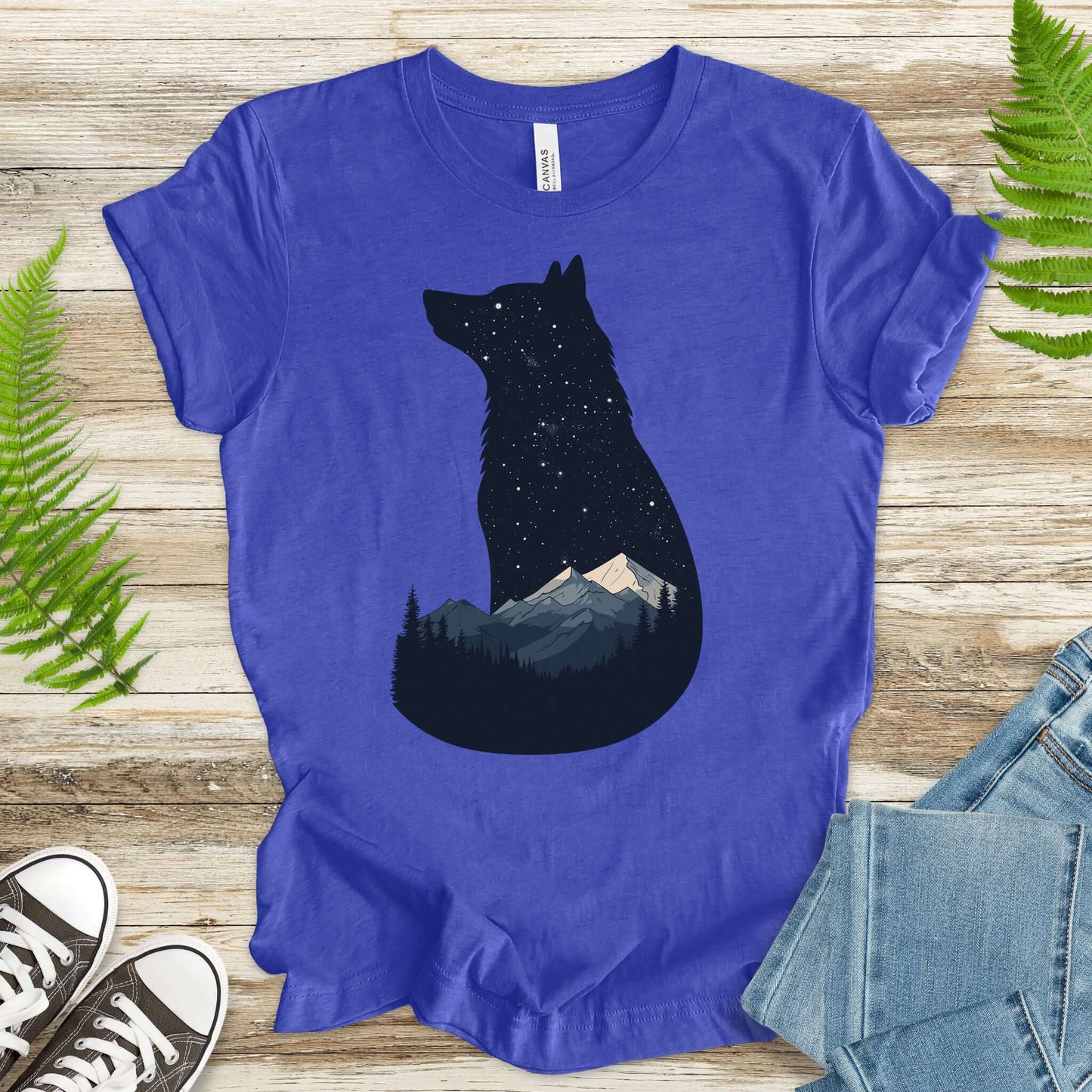 Wolf silhouette t-shirt with night sky and mountains design, perfect for nature lovers and adventurers.