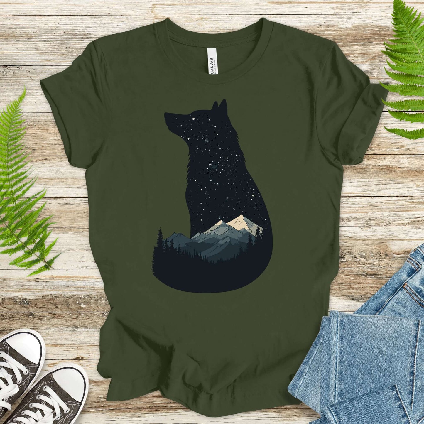 Wolf silhouette t-shirt featuring night mountain scene under starry sky, ideal for nature lovers.