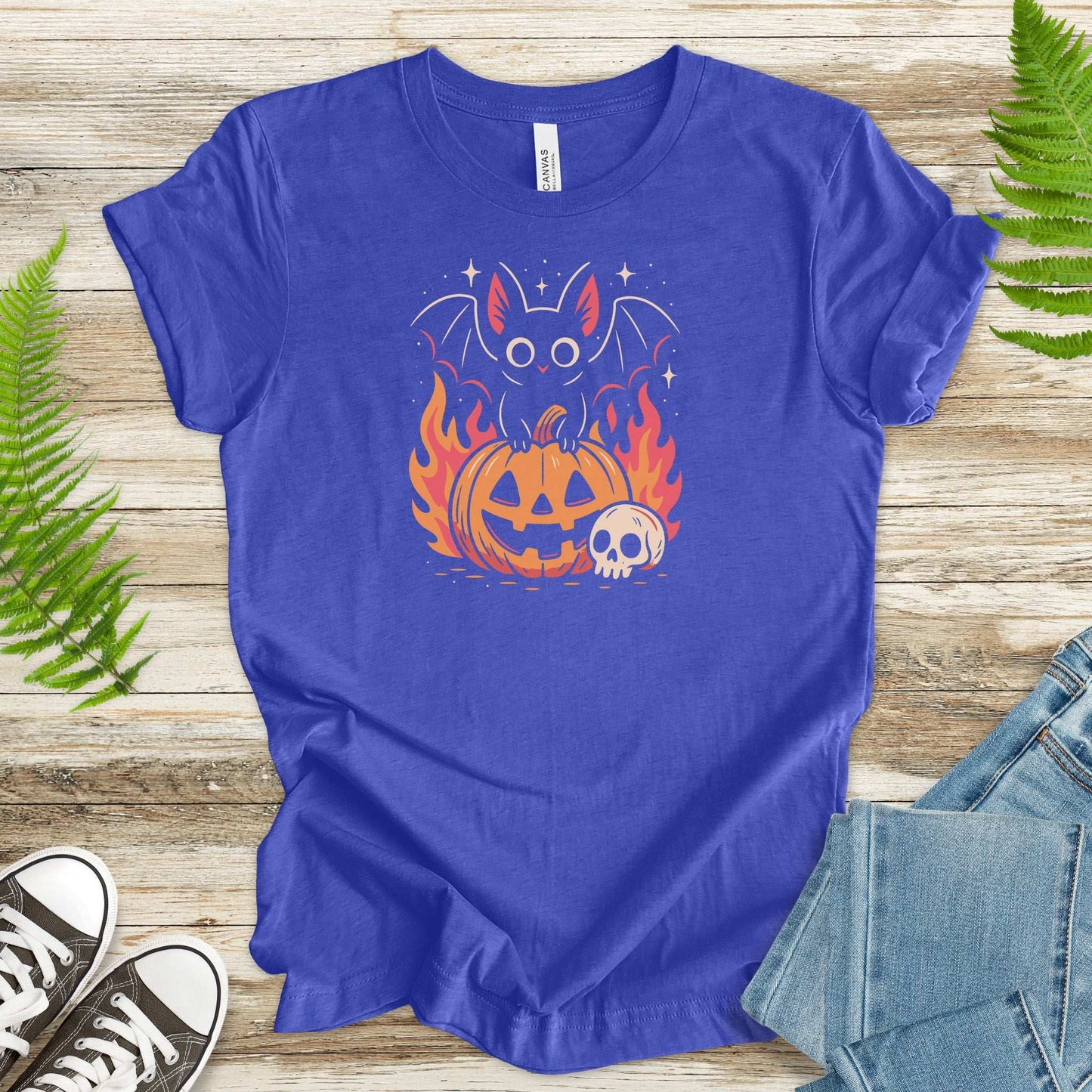Spooky Bat Halloween T-Shirt featuring a bat on a pumpkin with flames, perfect for cute gothic vibes and fall festivities.