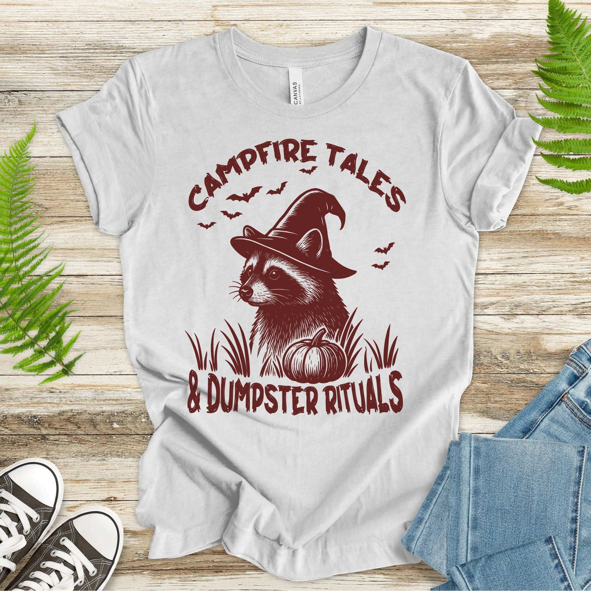Campfire Tales Raccoon Halloween T-shirt with witch hat and pumpkin design for spooky vibes.