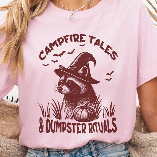 Campfire Tales Raccoon Halloween T-shirt featuring a raccoon in a witch hat with spooky pumpkin design.