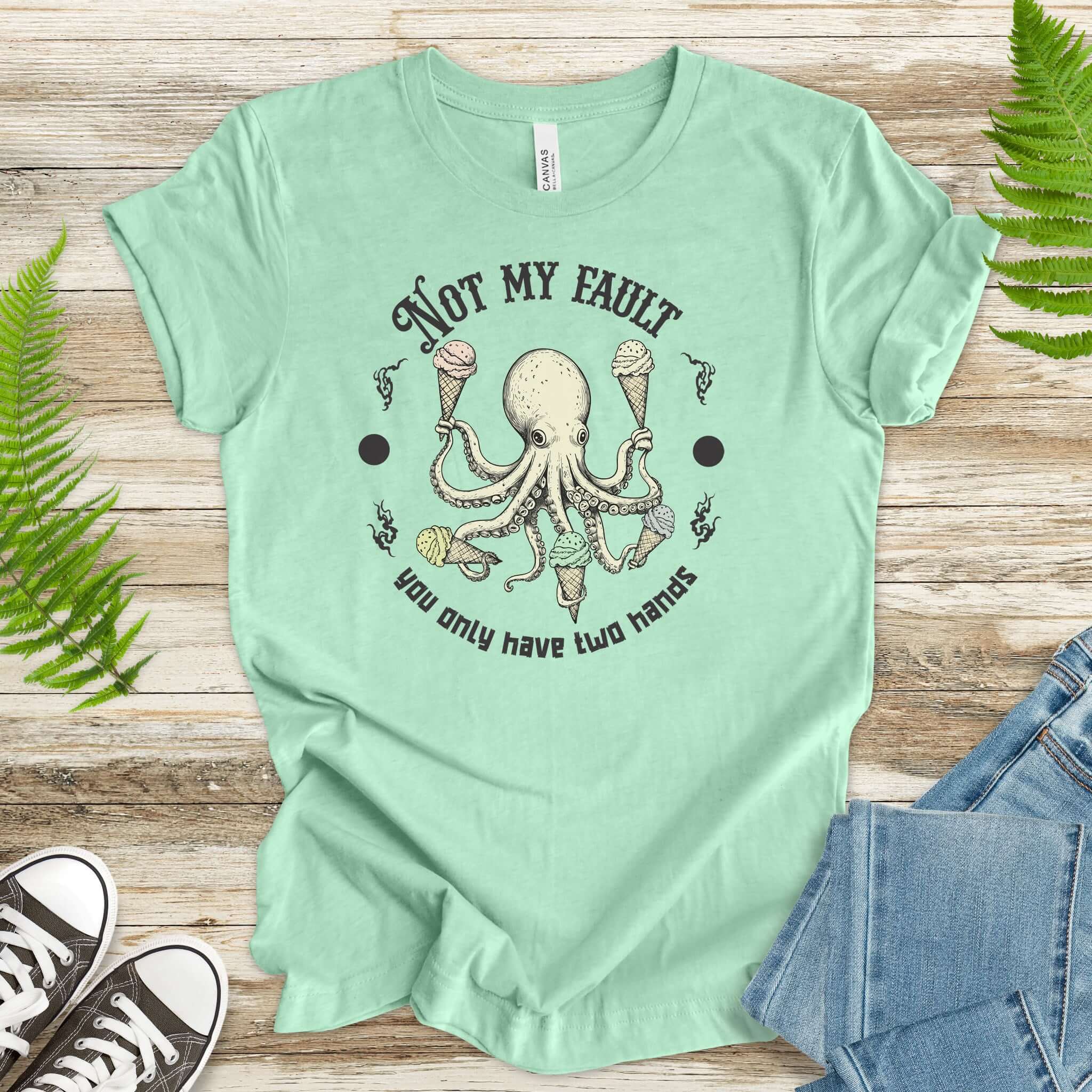 Funny octopus ice cream lover T-shirt, soft tee for animal lovers, saying 'Not My Fault You Only Have Two Hands'.