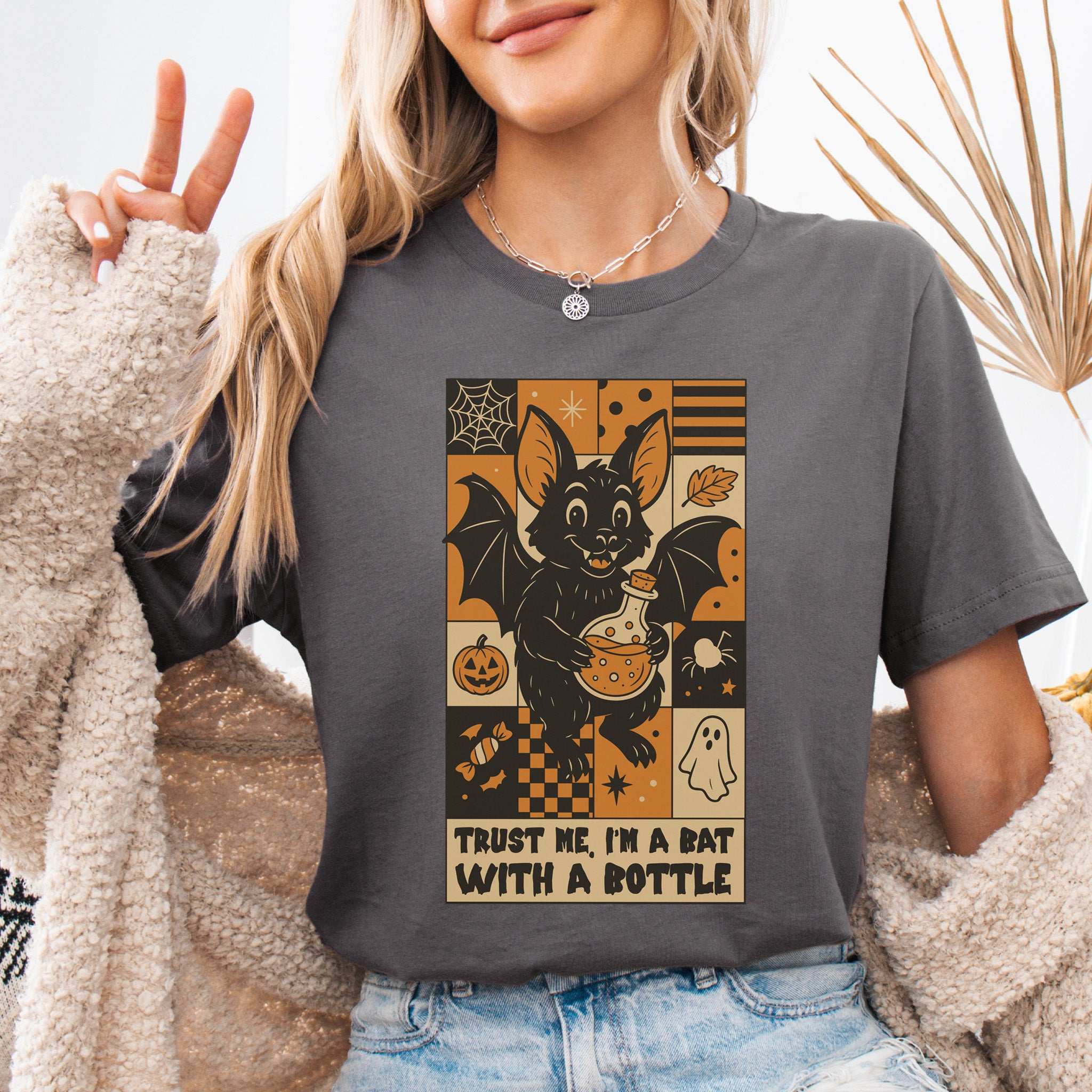 Potion Bat Halloween T-Shirt featuring a playful bat with a potion, perfect for spooky and retro Halloween fans.