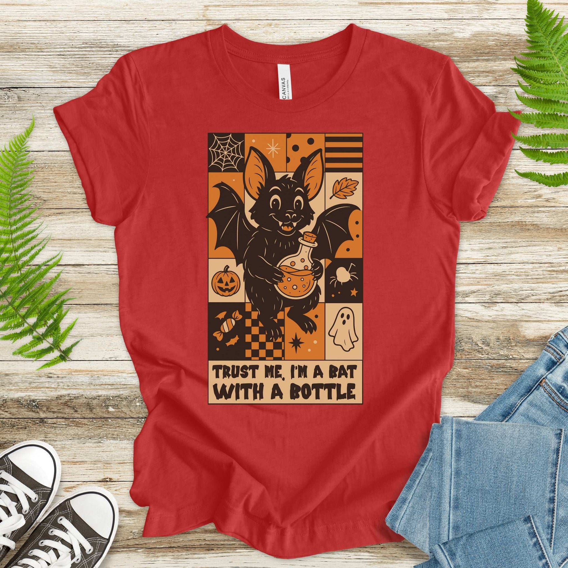 Potion Bat Halloween T-shirt featuring a cute bat with a bottle, perfect for spooky season and retro Halloween fans.