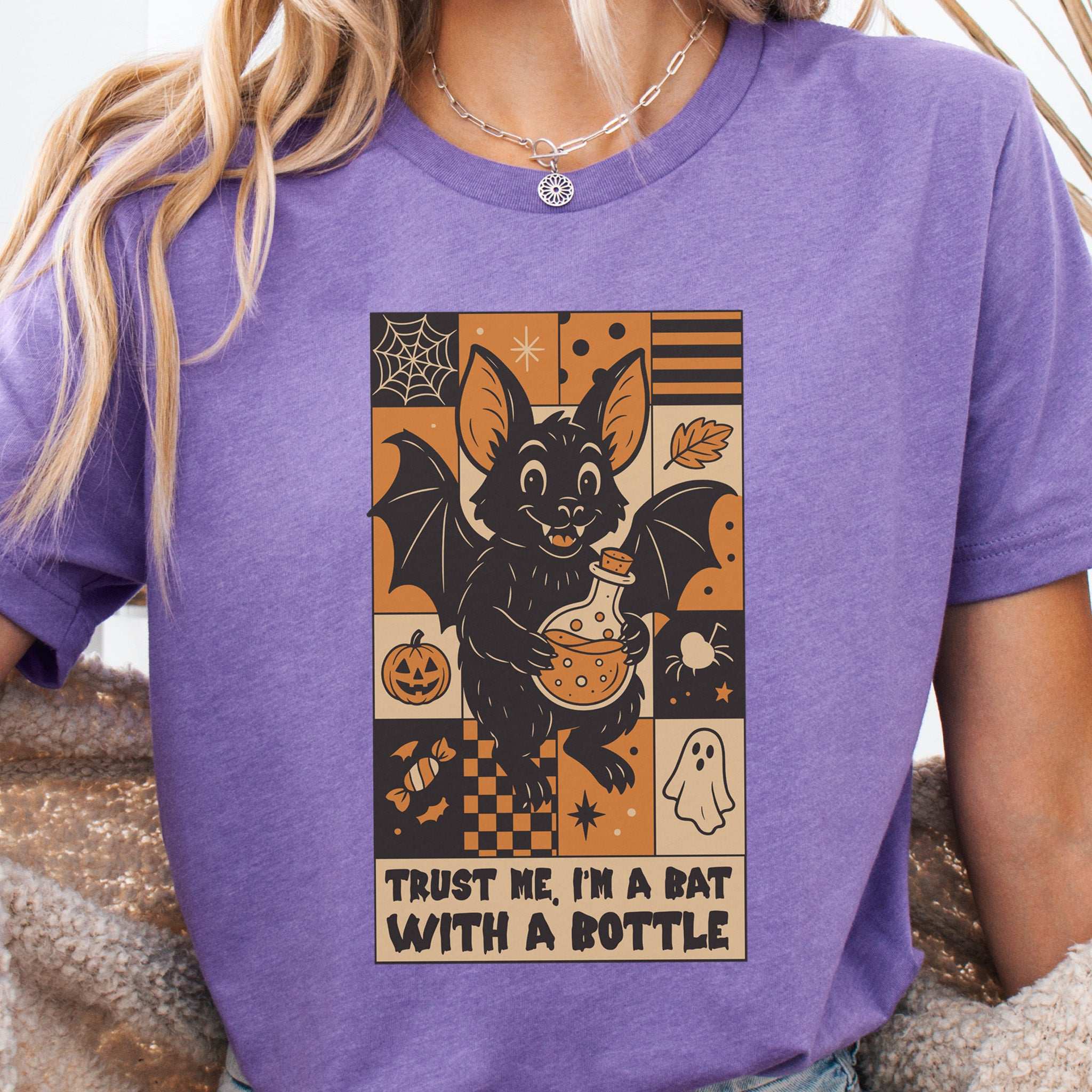 Potion Bat Halloween T-shirt featuring a whimsical bat with a potion, perfect for spooky retro fans.