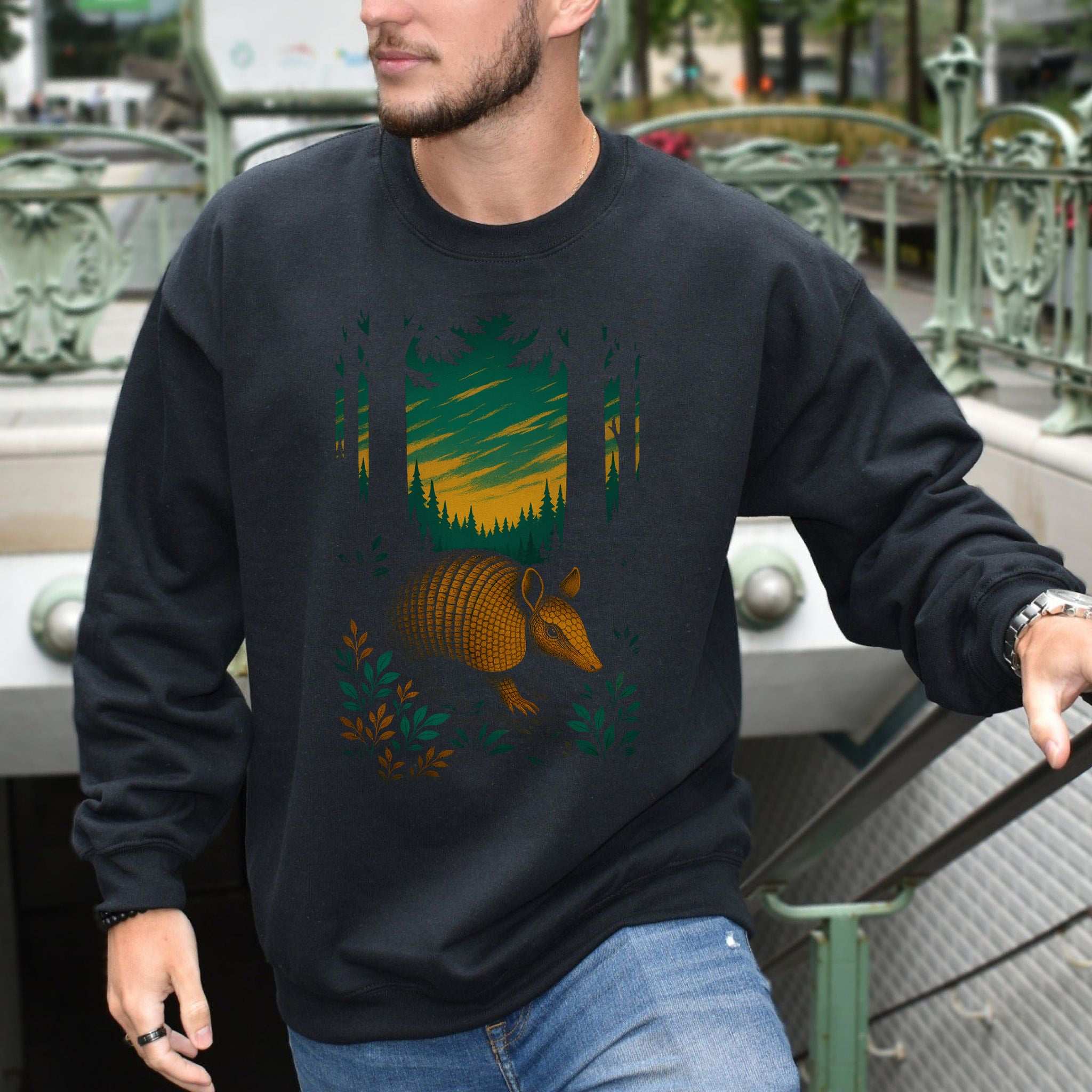 Armadillo Spirit Animal Sweatshirt – Mystical Forest Totem Vibes worn by a model in urban setting, showing vibrant forest design.
