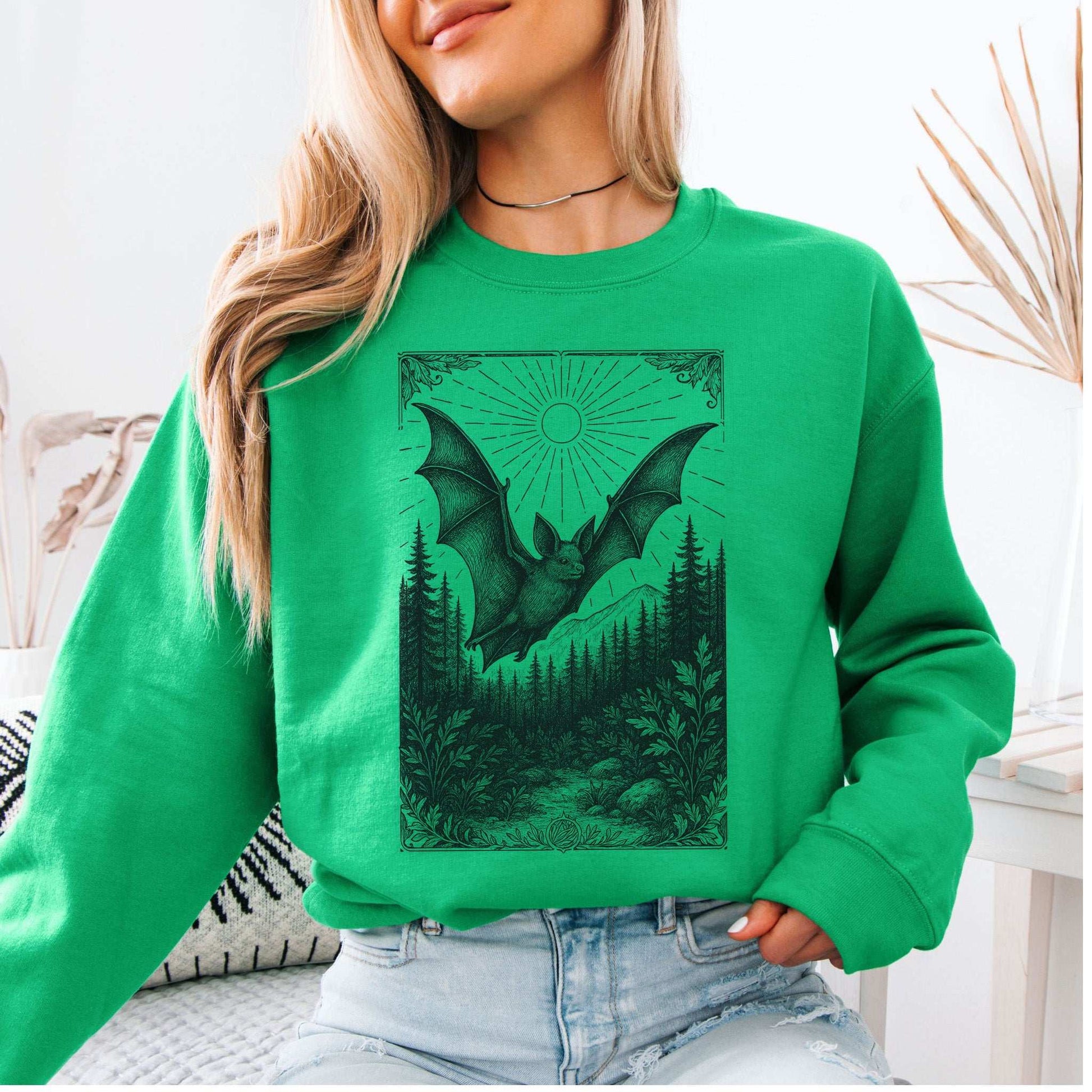Nocturnal Guide Bat Spirit Animal Sweatshirt featuring vintage bat design with forest and sun rays.
