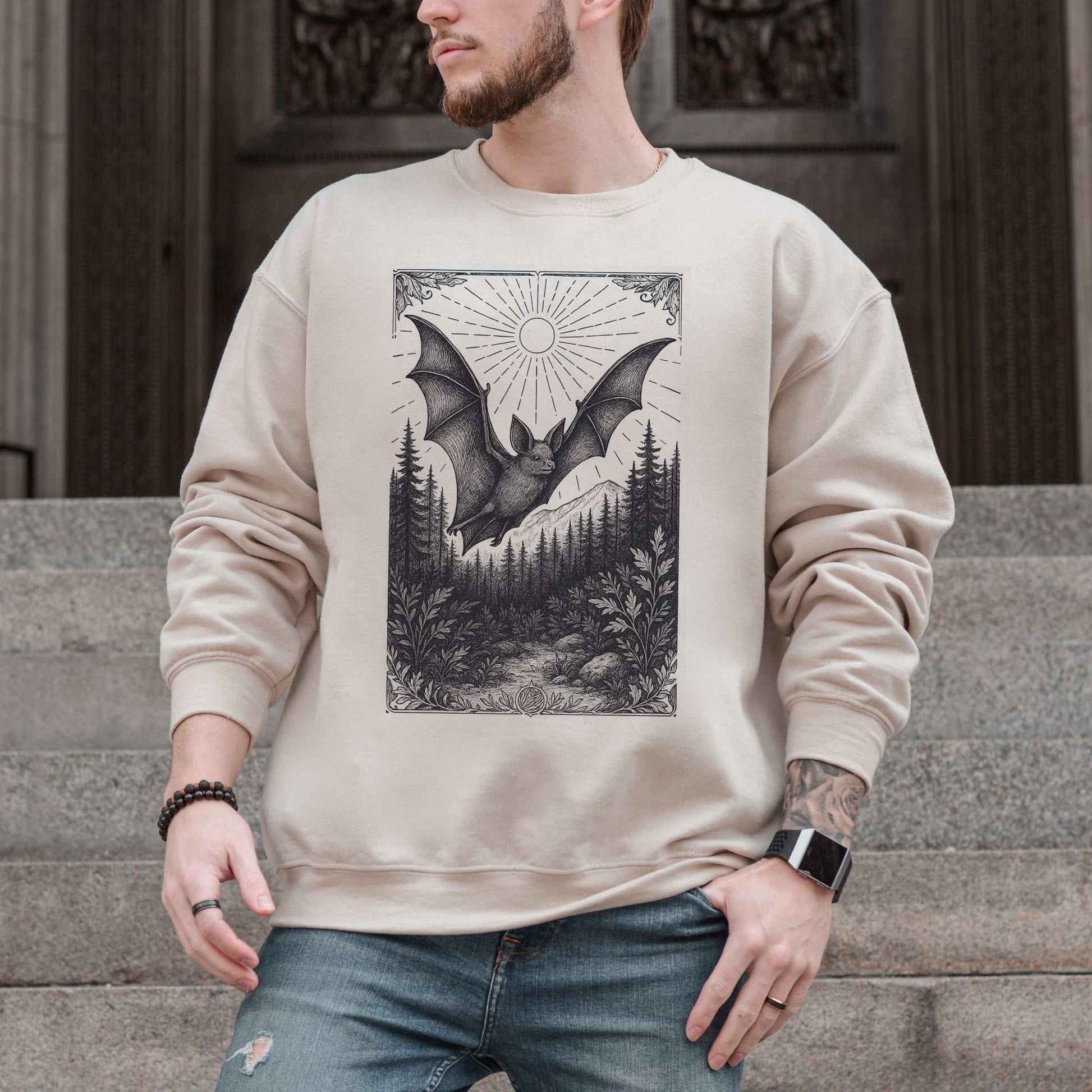 Nocturnal Guide bat spirit animal sweatshirt with vintage bat design and forest scenery, perfect for dark academia style.