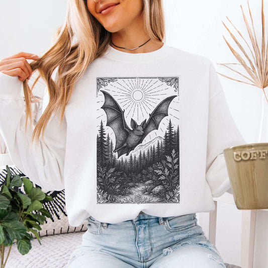 Nocturnal Guide bat spirit animal sweatshirt with mystical bat design and forest landscape.