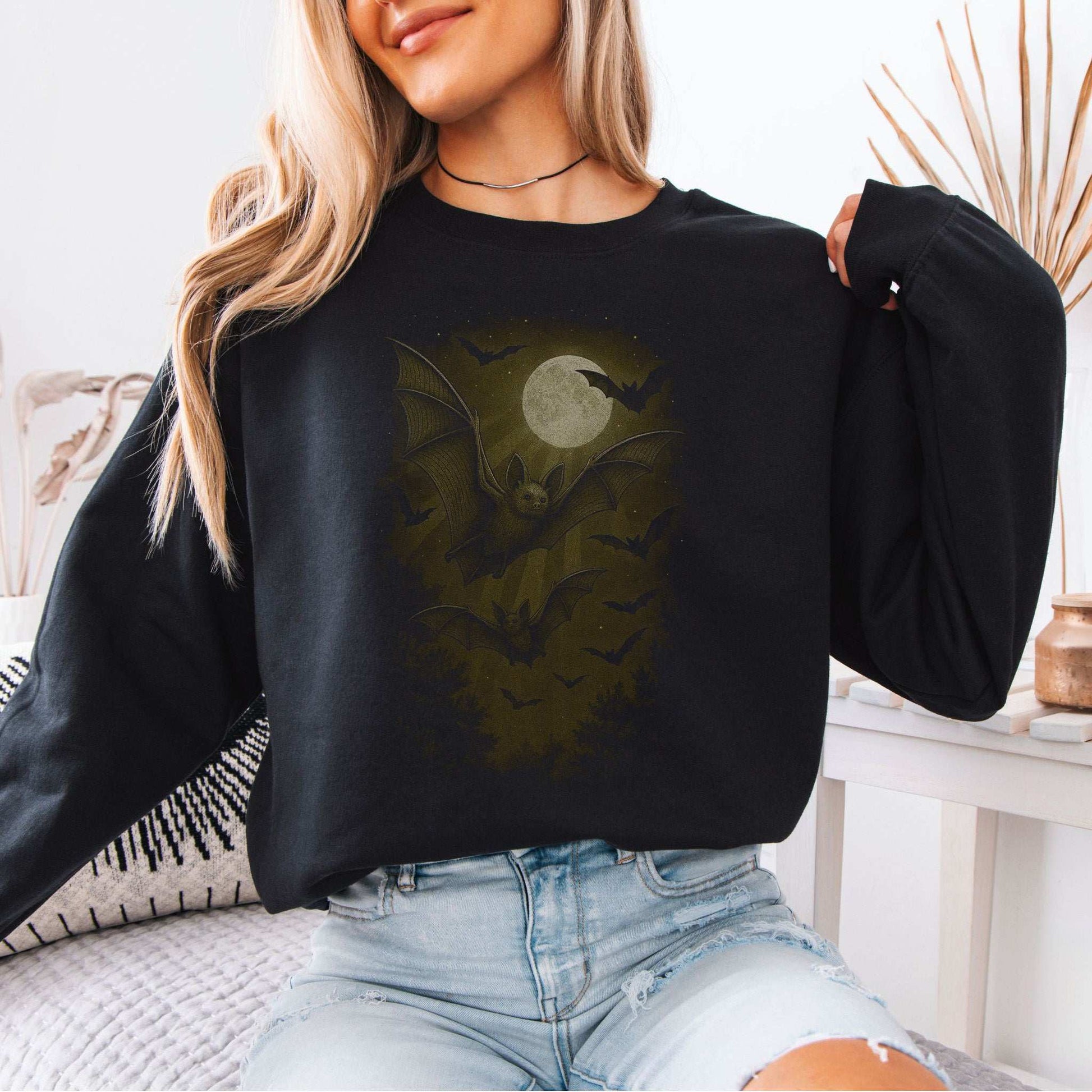 Bat Spirit Animal Sweatshirt – Full Moon Forest Flight Vibes featuring bats and moonlight on a cozy black sweatshirt.