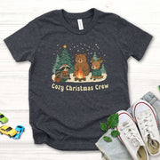 Cozy Christmas Crew Youth Tee – Cute Forest Animal Campfire Shirt