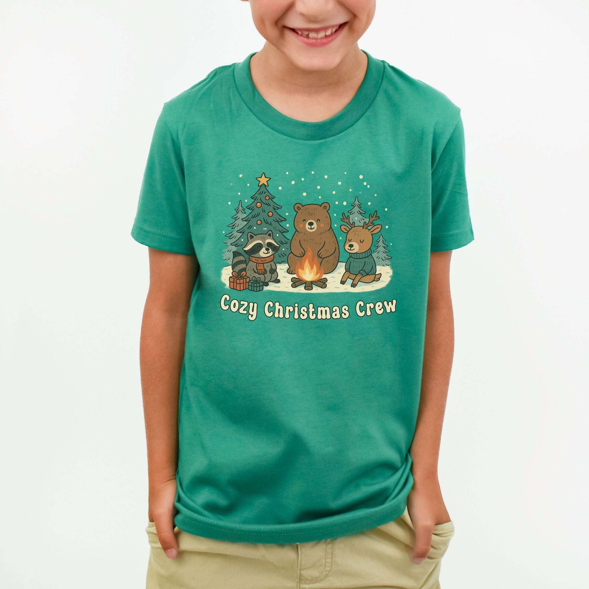 Cozy Christmas Crew Youth Tee – Cute Forest Animal Campfire Shirt