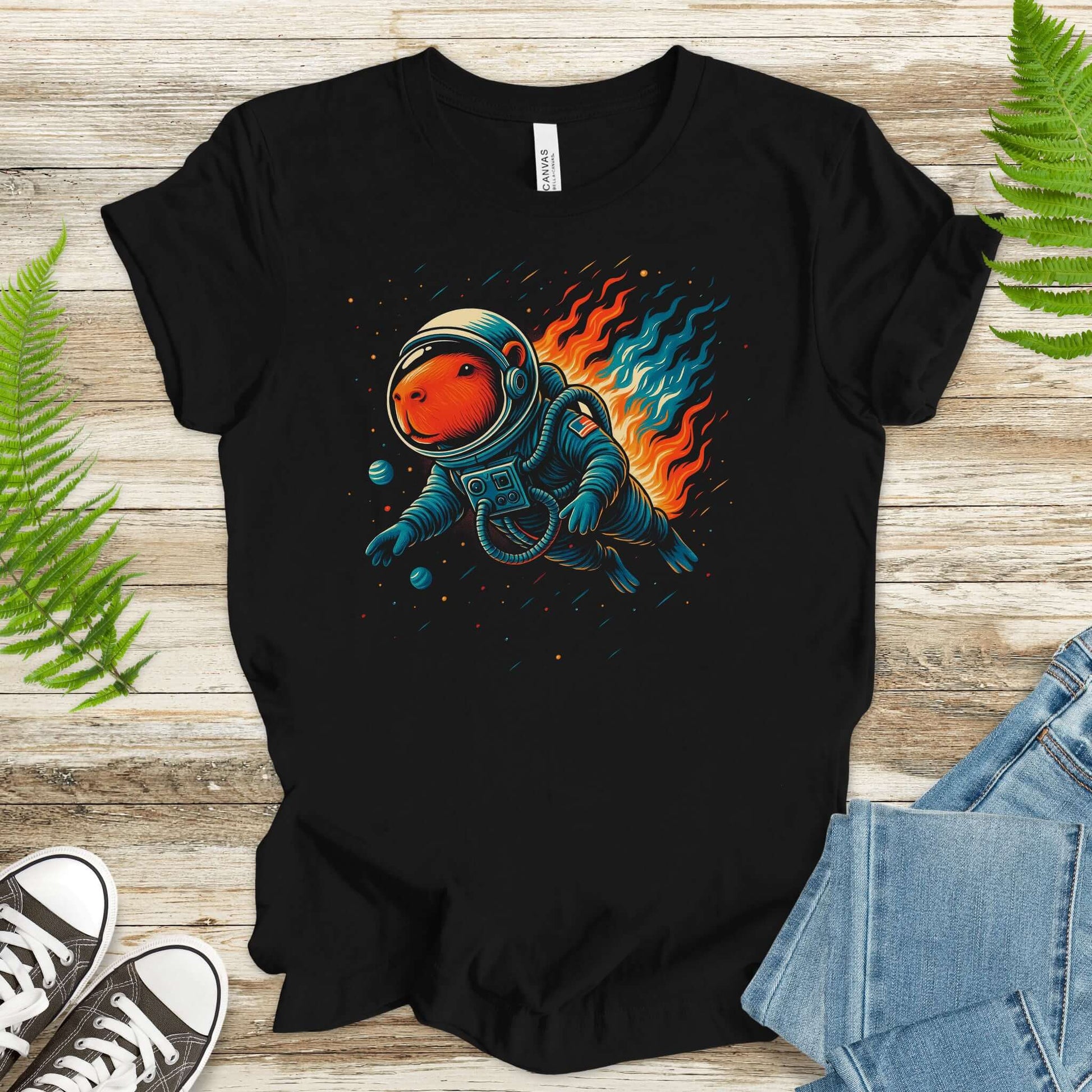 Capybara astronaut t-shirt for fantasy lovers, featuring an adorable capybara in space with colorful flames.