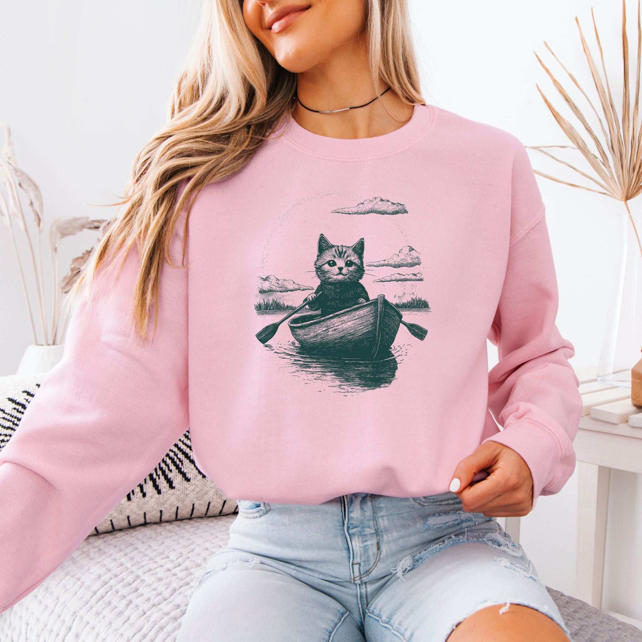 Mysterious Rowboat Cat Sweatshirt – Surreal Moody Art Style