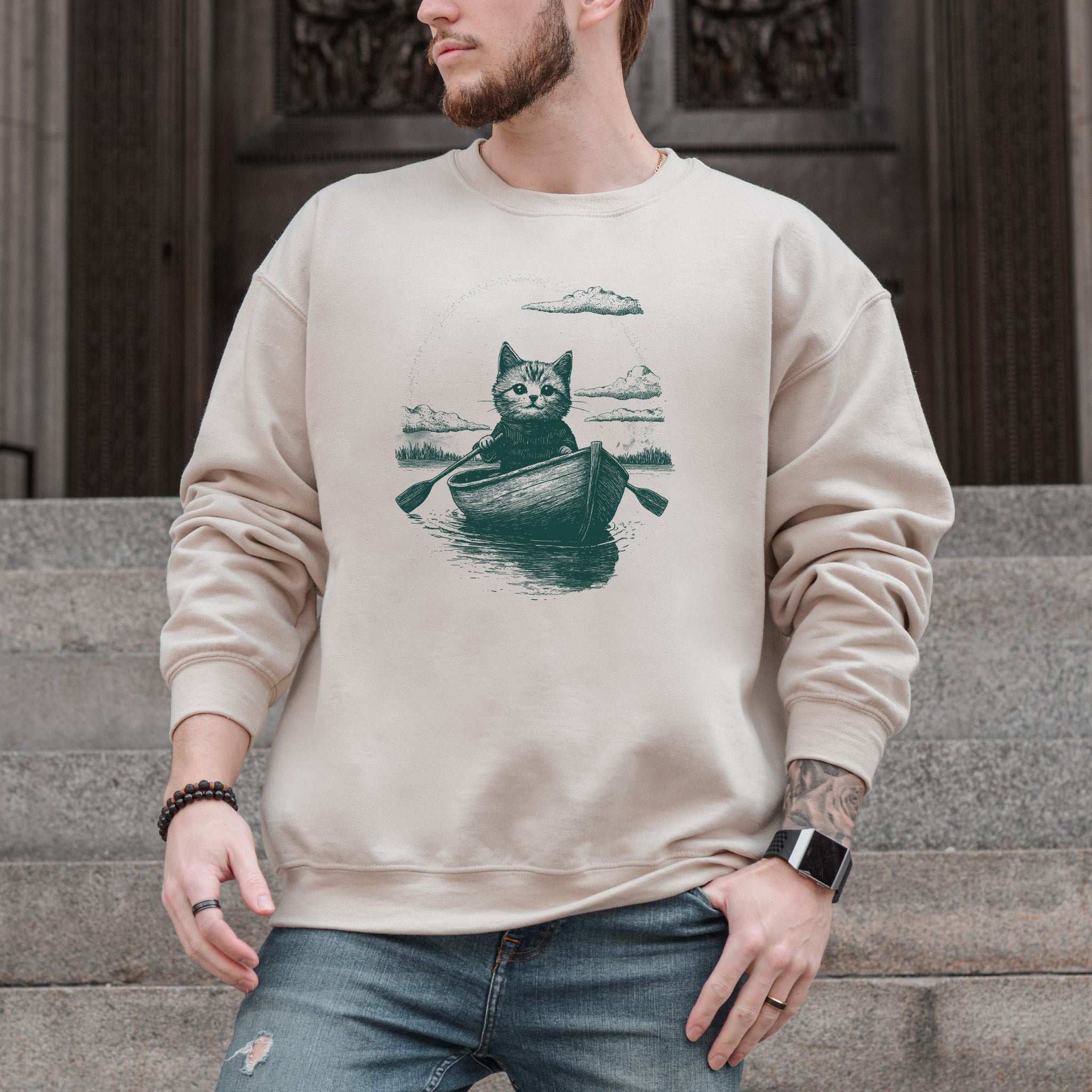 Mysterious Rowboat Cat Sweatshirt – Surreal Moody Art Style
