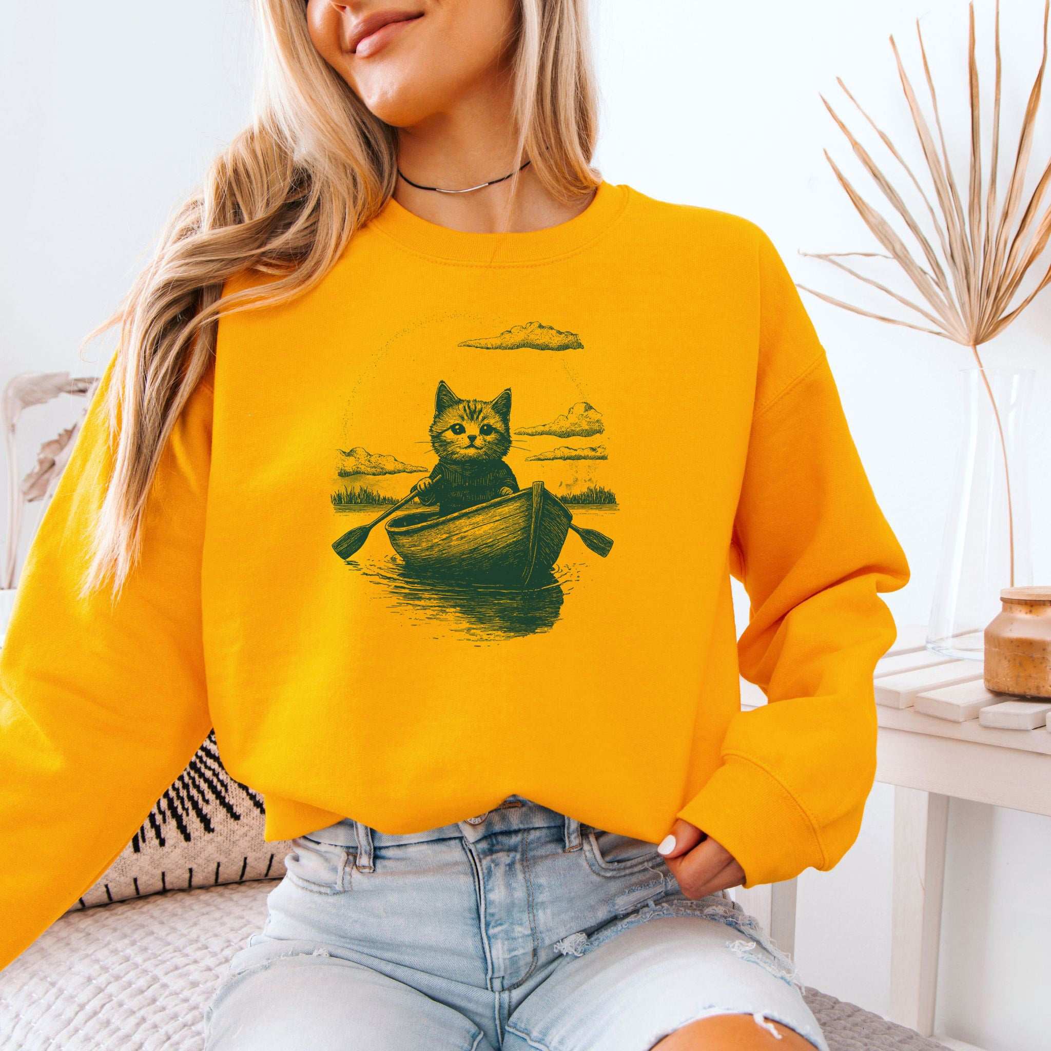 Mysterious Rowboat Cat Sweatshirt – Surreal Moody Art Style
