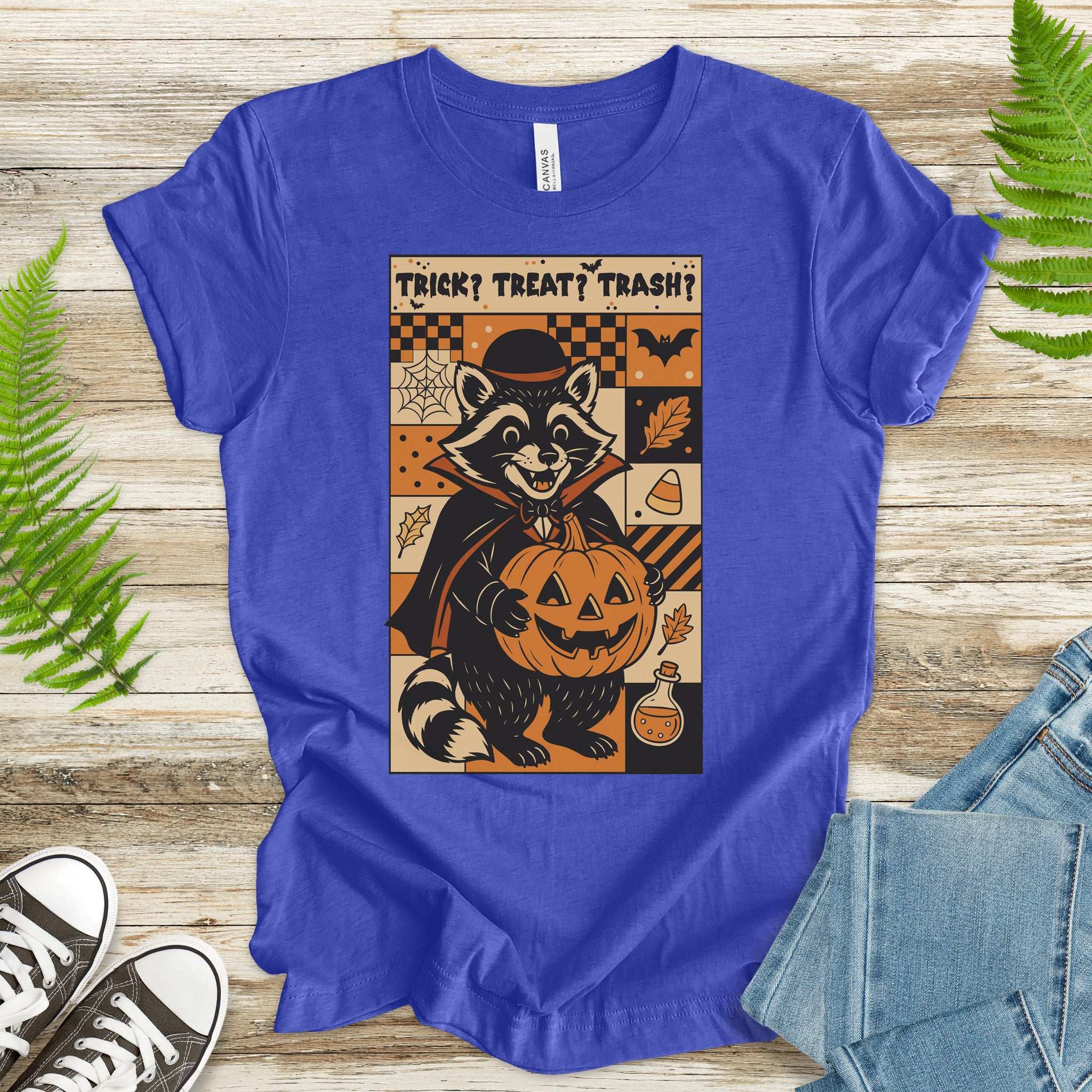 Dracula Raccoon Halloween T-shirt with pumpkin, retro comic vibes, text: Trick? Treat? Trash?