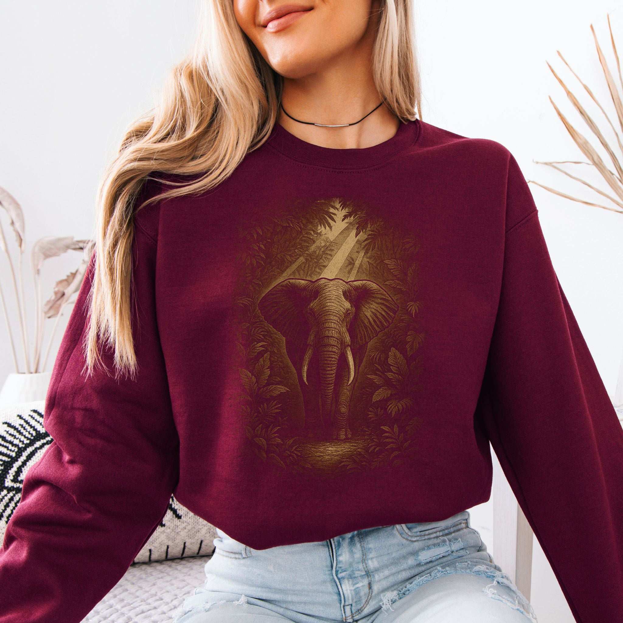 Elephant Spirit Animal Sweatshirt – Jungle Majesty & Safari Soul featuring an elephant in a lush design on a burgundy sweatshirt.
