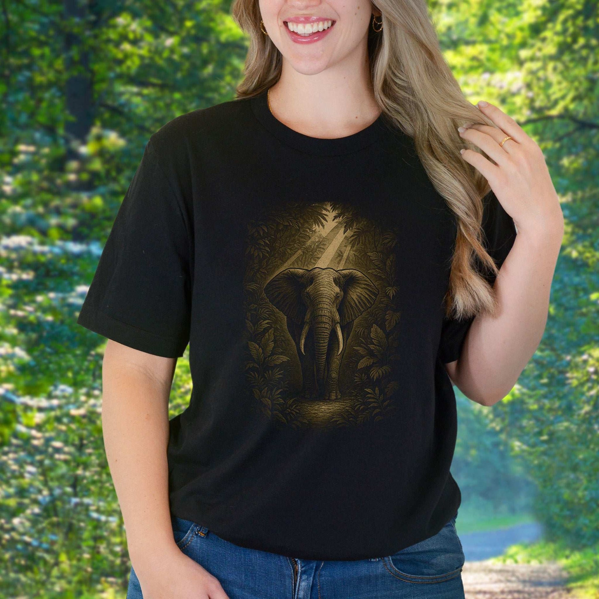 Elephant Spirit Animal T-Shirt – Jungle Majesty & Safari Soul worn by a woman in a lush green setting.