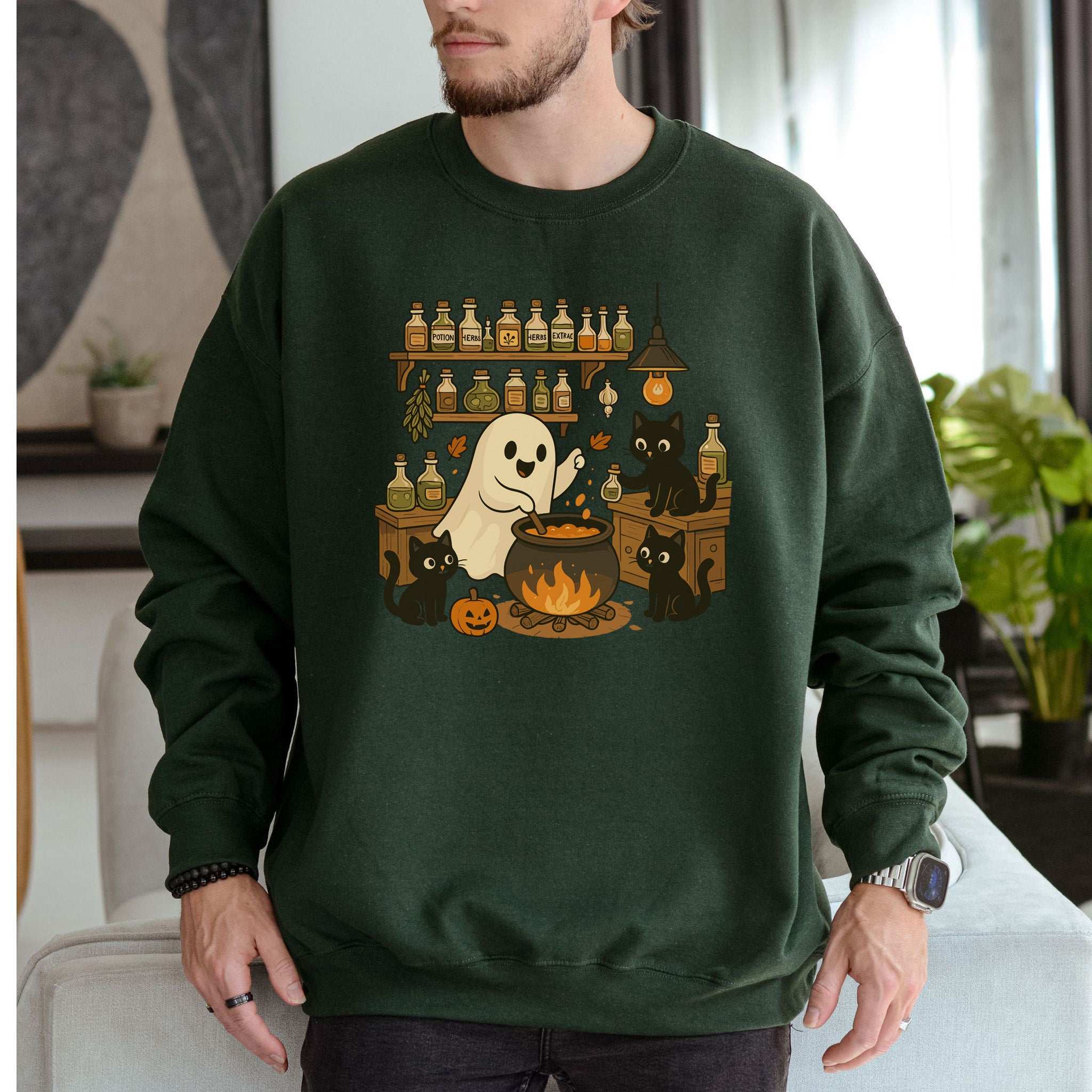 Ghost & Black Cats Cooking Halloween Sweatshirt featuring a spooky ghost and black cats in a cozy kitchen.