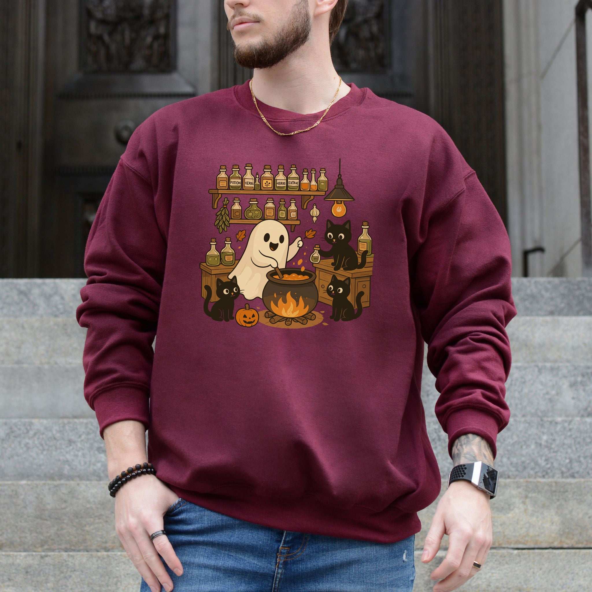 Ghost & Black Cats Cooking Halloween Sweatshirt featuring a ghost and black cats, perfect for spooky season and cozy fall vibes.