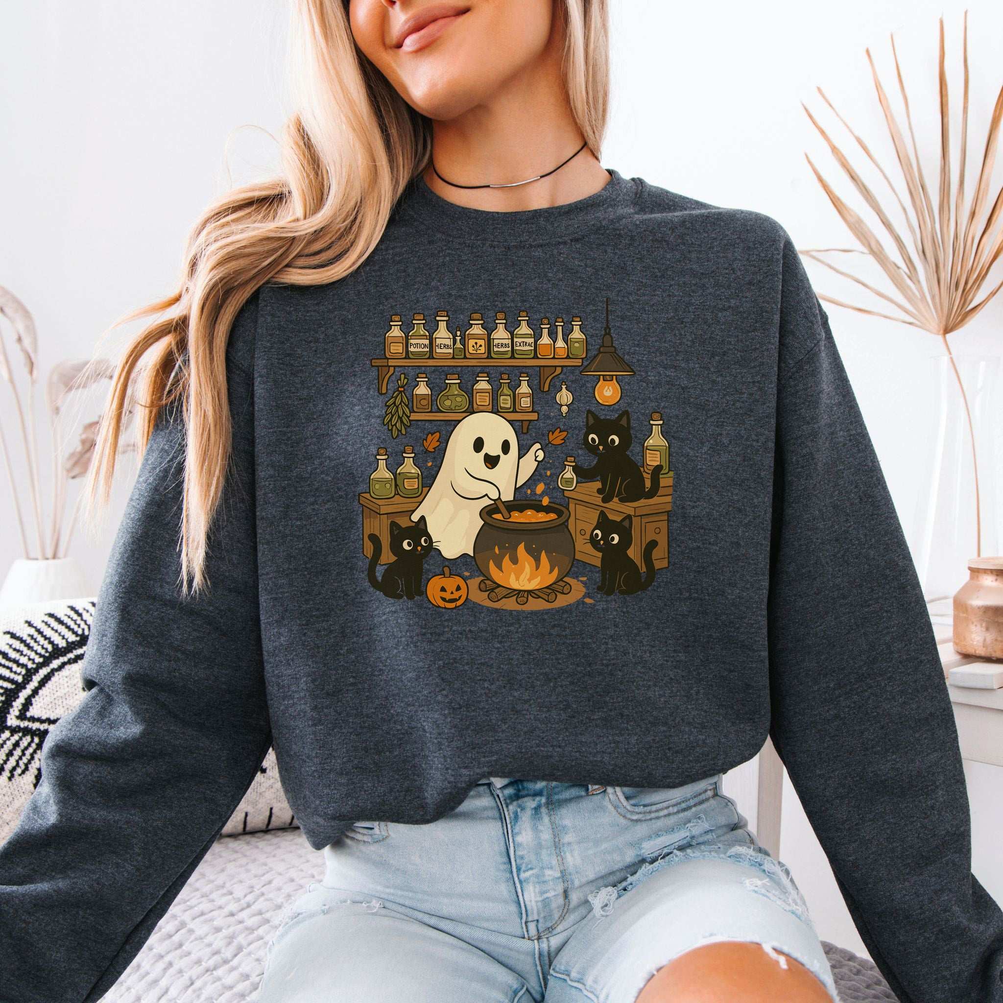 Ghost & Black Cats Cooking Halloween Sweatshirt with a cute ghost and black cats brewing potions.