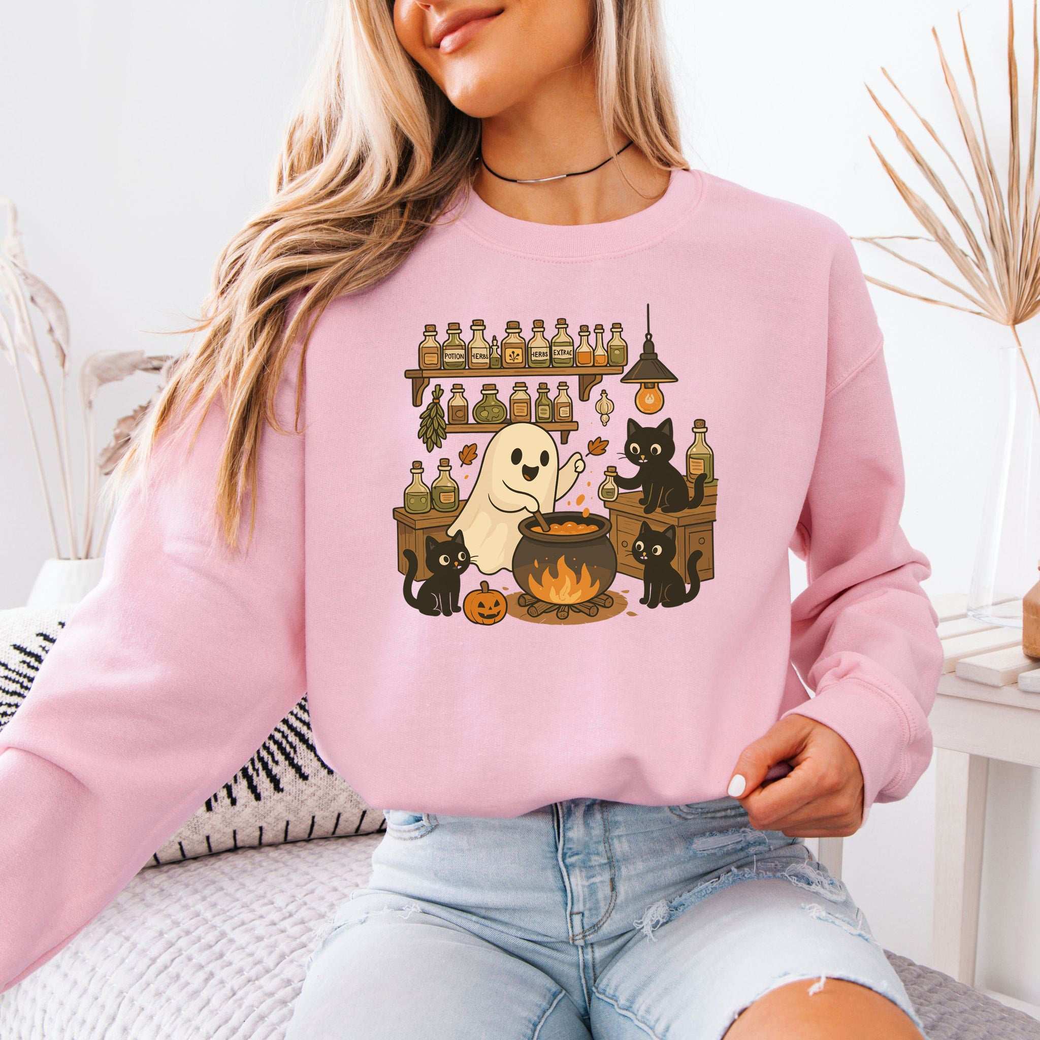 Cute Ghost & Black Cats Halloween sweatshirt with a cozy chef stirring a cauldron, perfect for spooky season.