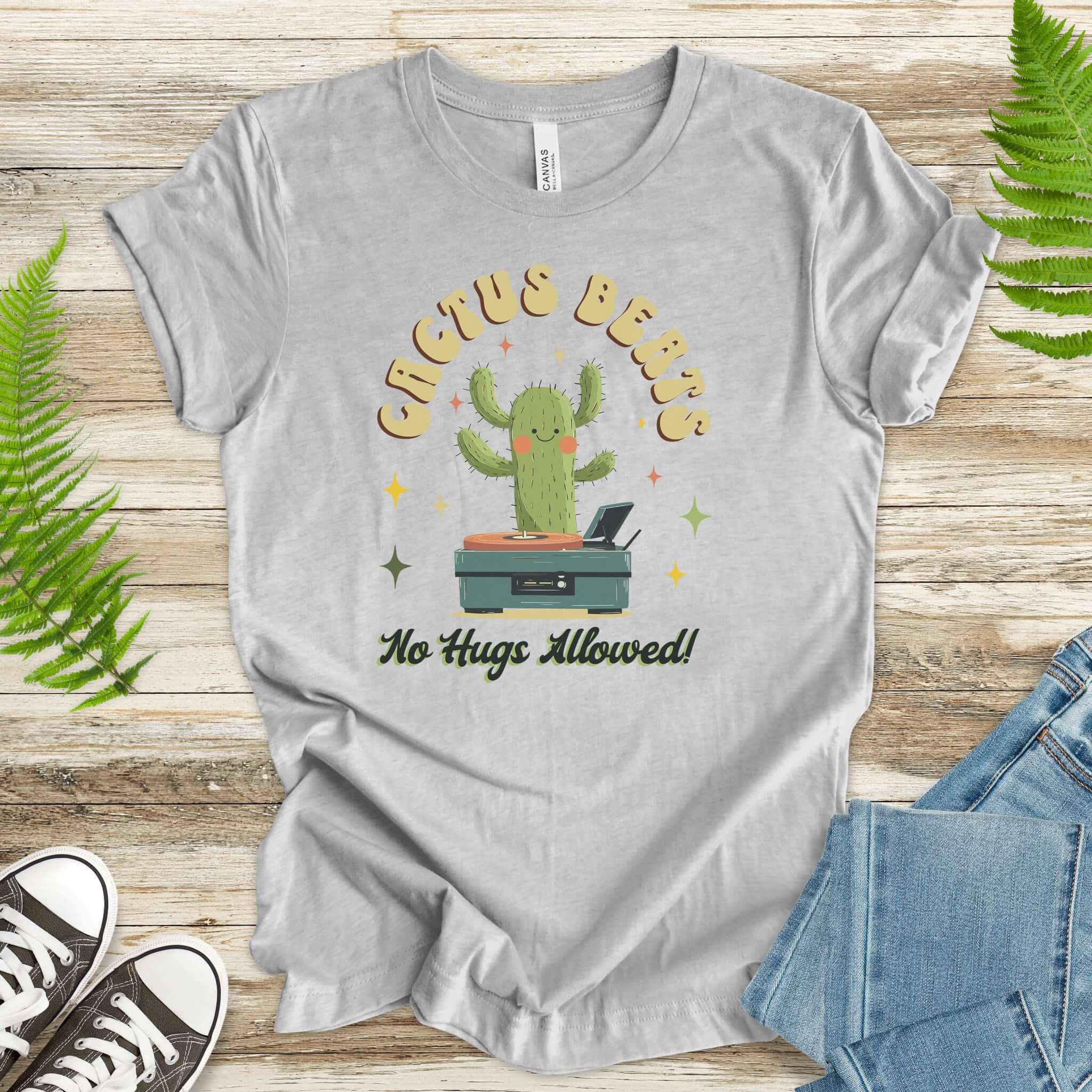 Funny retro cactus DJ graphic tee with the text 'Cactus Beats – No Hugs Allowed!' on a soft cotton t-shirt.