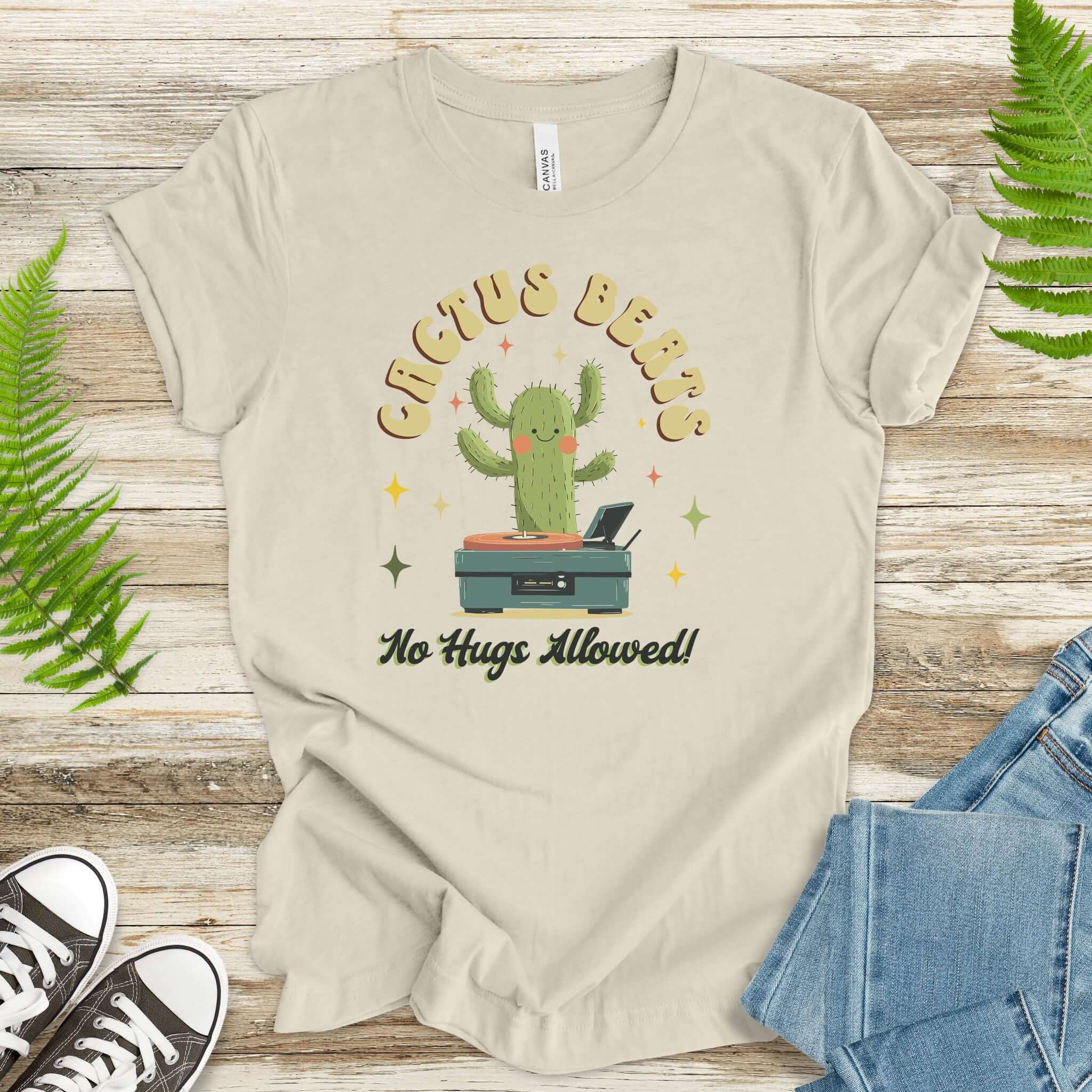 Funny Retro DJ Cactus T-Shirt featuring a cactus DJ with the text 'No Hugs Allowed!' in soft cotton fabric.