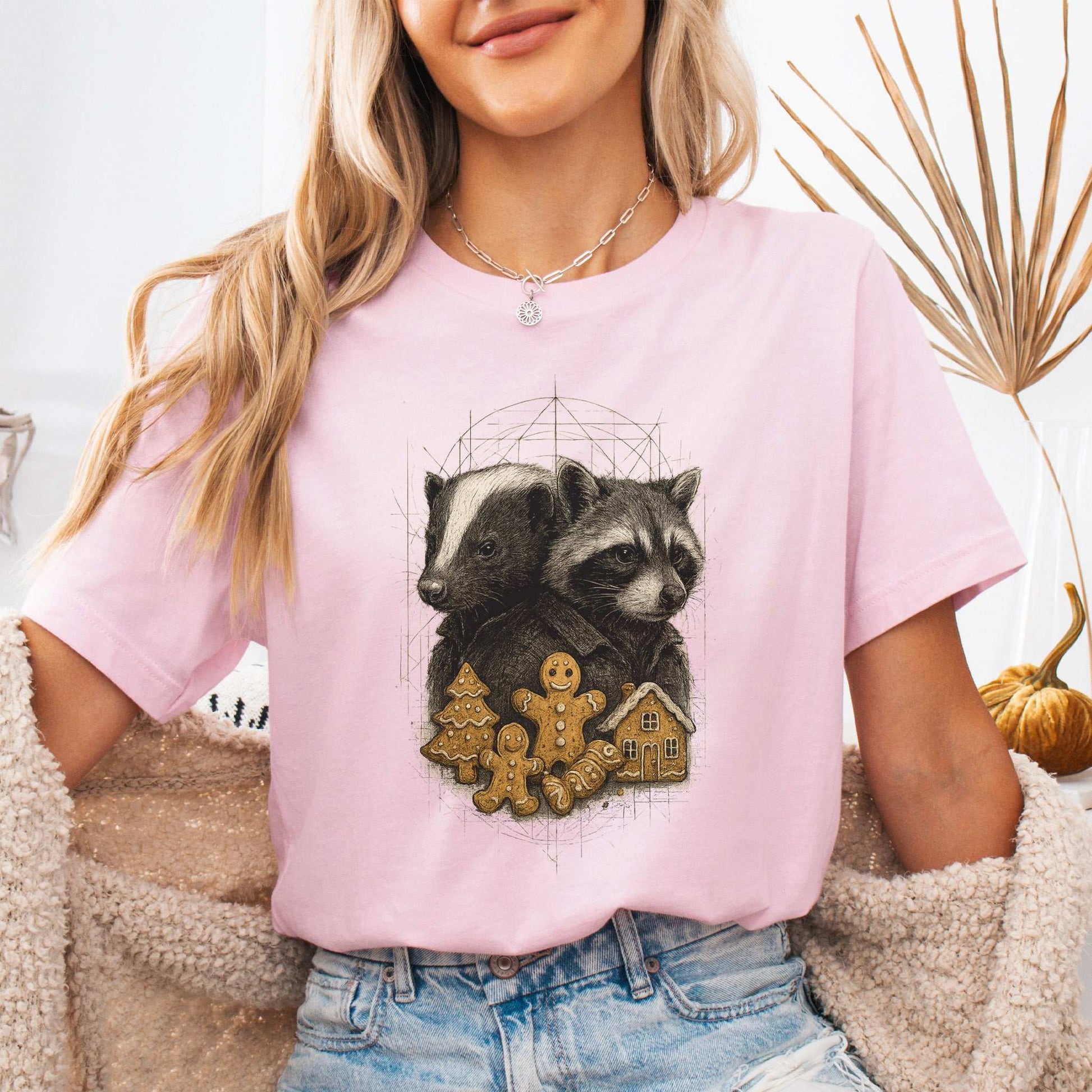 Skunk & Raccoon Christmas T-Shirt – Gingerbread Mischief & Forest Charm