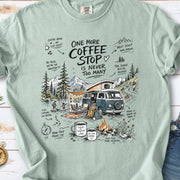 A retro camper van parked by the water with mountain views and camp chairs design on a Bay Comfort Colors T-shirt
