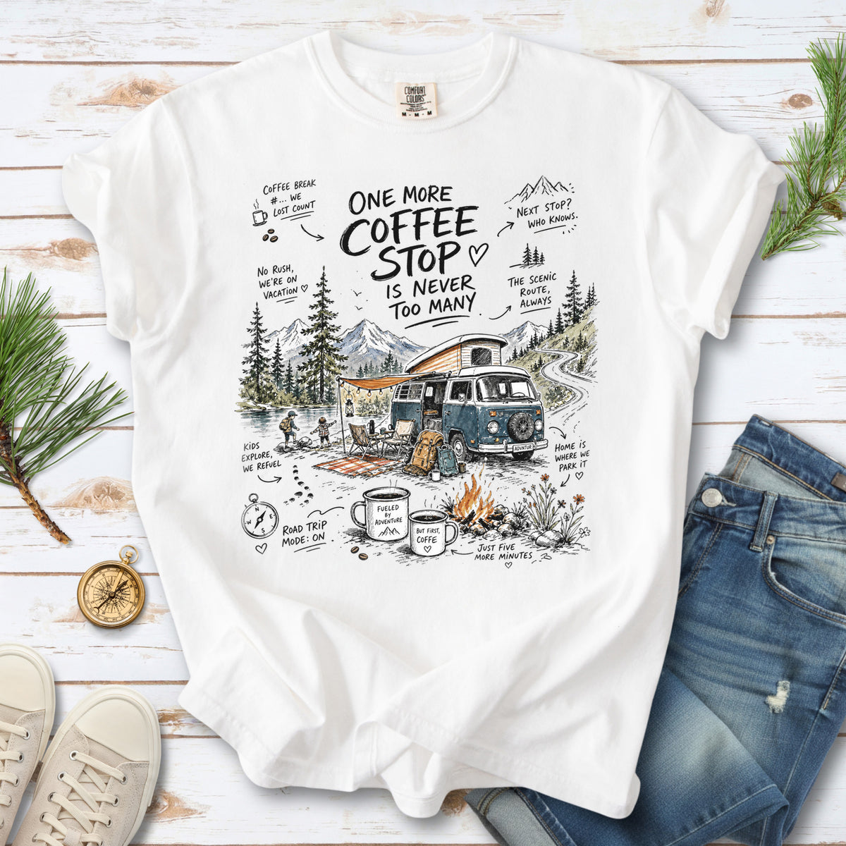 A retro camper van parked by the water with mountain views and camp chairs design on a White Comfort Colors T-shirt