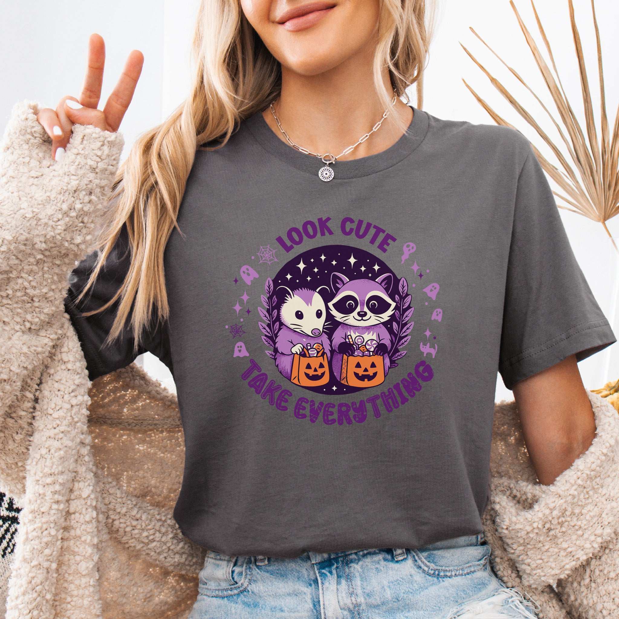 Opossum & Raccoon Halloween T-shirt with 'Look Cute, Take Everything' design, perfect for Halloween fun.